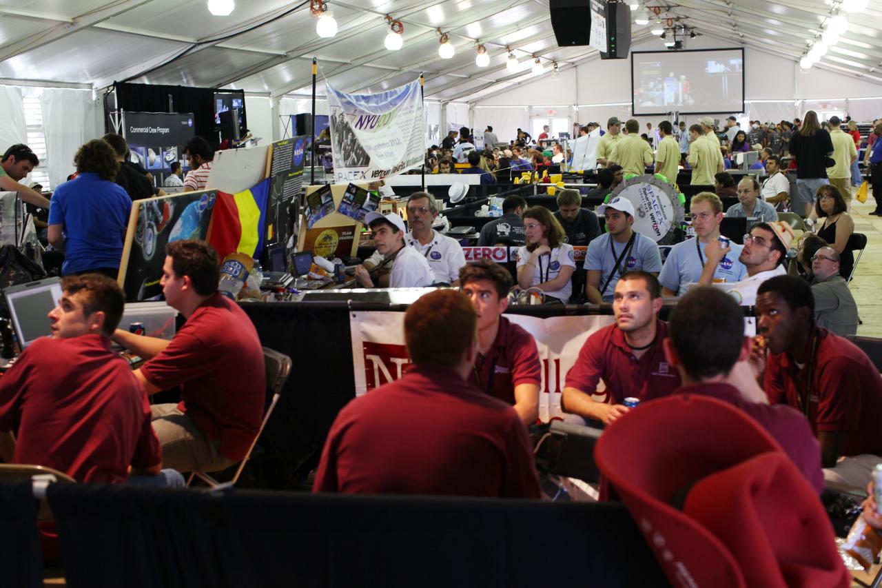 CAPE CANAVERAL, Fla. - At NASA’s Kennedy Space Center Visitor Complex in Florida, U.S. and international college students watch the opening ceremony for NASA’s Lunabotics Mining Competition.    The mining competition is sponsored by NASA Kennedy Space Center’s Education Office for the agency’s Exploration Systems Mission Directorate. Undergraduate and graduate students from more than 50 universities and colleges in the U.S. and other countries use their remote-controlled Lunabots to maneuver and dig in a supersized sandbox filled with a crushed material that has characteristics similar to lunar soil. For more information, visit www.nasa.gov/lunabotics. Photo credit: NASA/Frankie Martin