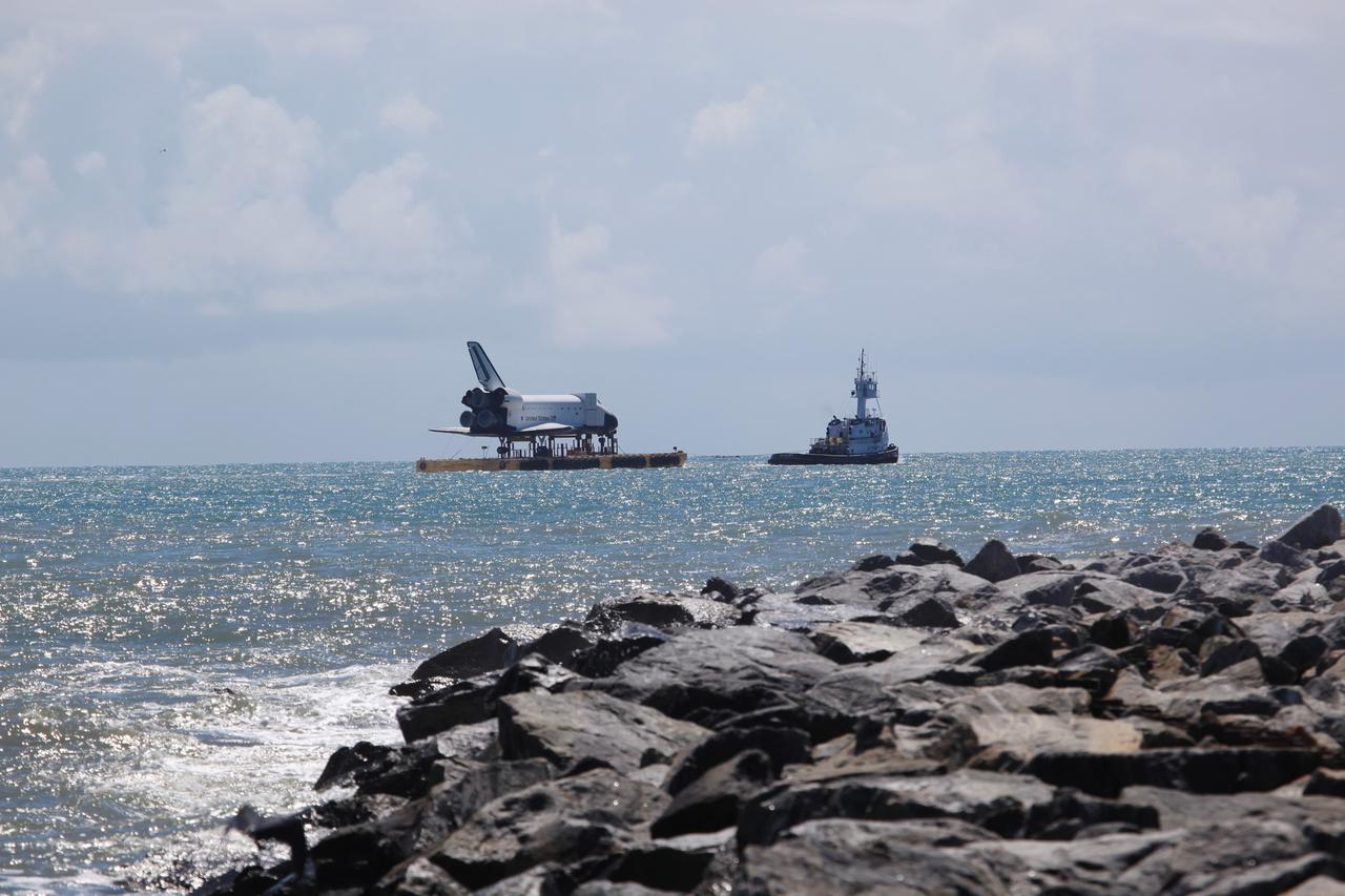 CAPE CANAVERAL, Fla. – The high-fidelity space shuttle model sails through Port Canaveral into the Atlantic Ocean. The model is en route by barge from NASA’s Kennedy Space Center in Florida to Space Center Houston, NASA Johnson Space Center’s official visitor center. Its journey to Texas will take it south along the Florida coastline, around Key West and into the Gulf of Mexico. The model was built in Apopka, Fla., by Guard-Lee and installed at the Kennedy Space Center Visitor Complex in 1993. The model is expected to arrive June 1 in Houston and to be transported June 3 to Space Center Houston, its final destination, where it will become part of a unique display telling the story of the space shuttle’s achievements and the nationwide team that made them possible. For more information about Space Center Houston, visit http://www.spacecenter.org. Photo credit: NASA/Dimitri Gerondidakis