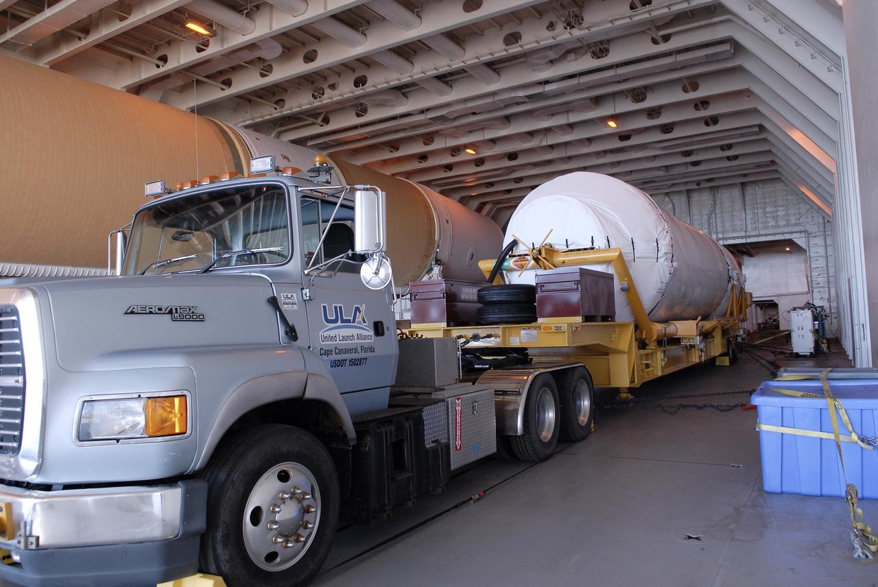 CAPE CANAVERAL, Fla. – The Centaur upper stage sits on its transport trailer inside the Delta Mariner at Port Canaveral. The upper stage is destined to help launch the Radiation Belt Storm Probes, or RBSP, mission. It was removed from the ship and taken to the Atlas Spaceflight Operations Center, or ASOC, to begin checkout for the launch. Photo credit: NASA/Charisse Nahser