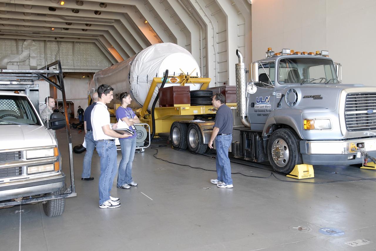 CAPE CANAVERAL, Fla. – The Centaur upper stage sits on its transport trailer inside the Delta Mariner at Port Canaveral as crews prepare to move it from the ship to the Atlas Spaceflight Operations Center, or ASOC, to begin checkout for the launch of the Radiation Belt Storm Probes, or RBSP, mission. Photo credit: NASA/Charisse Nahser