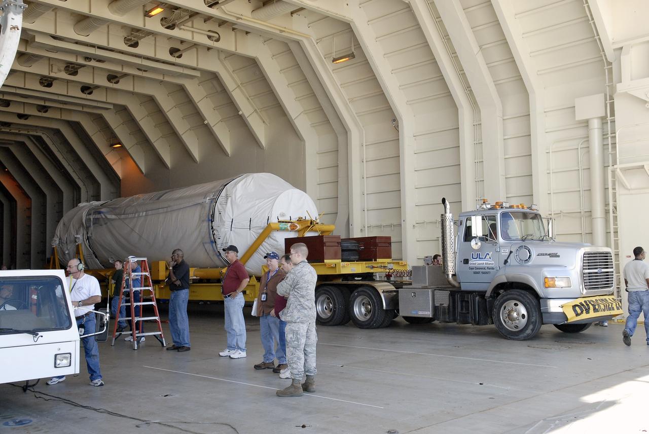 CAPE CANAVERAL, Fla. – The Centaur upper stage sits on its transport trailer inside the Delta Mariner at Port Canaveral as crews prepare to move it from the ship to the Atlas Spaceflight Operations Center, or ASOC, to begin checkout for the launch of the Radiation Belt Storm Probes, or RBSP, mission. Photo credit: NASA/Charisse Nahser