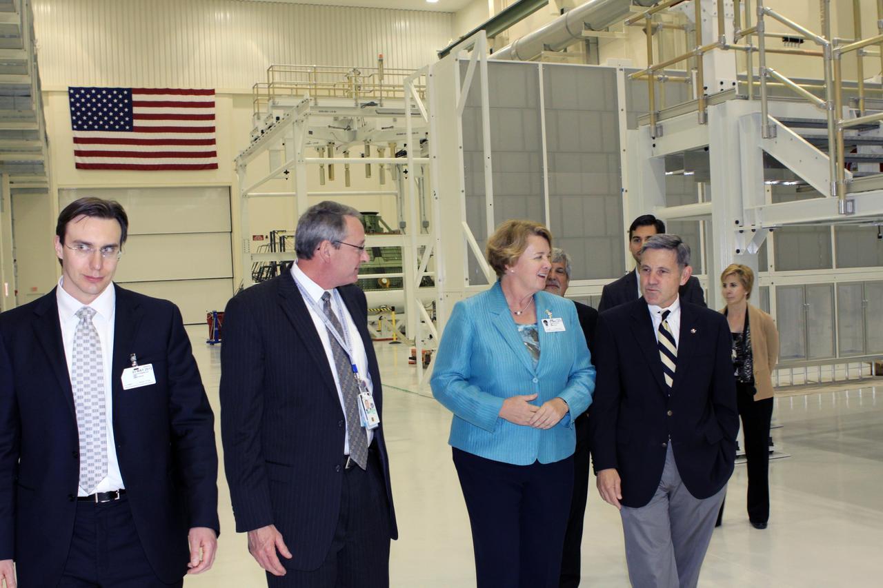 CAPE CANAVERAL, Fla. – Lockheed Martin and NASA personnel accompany Joanne Maguire, executive vice president of Space Systems for Lockheed Martin, and Kennedy Space Center Director Bob Cabana, far right, during a tour of Kennedy's Operations and Checkout Building.     Lockheed Martin is the prime contractor to NASA for the Orion Multi-Purpose Crew Vehicle, which will be processed in the refurbished Operations and Checkout building. For more information, visit http://www.nasa.gov/exploration/systems/ground. Photo credit: NASA/Jim Grossmann