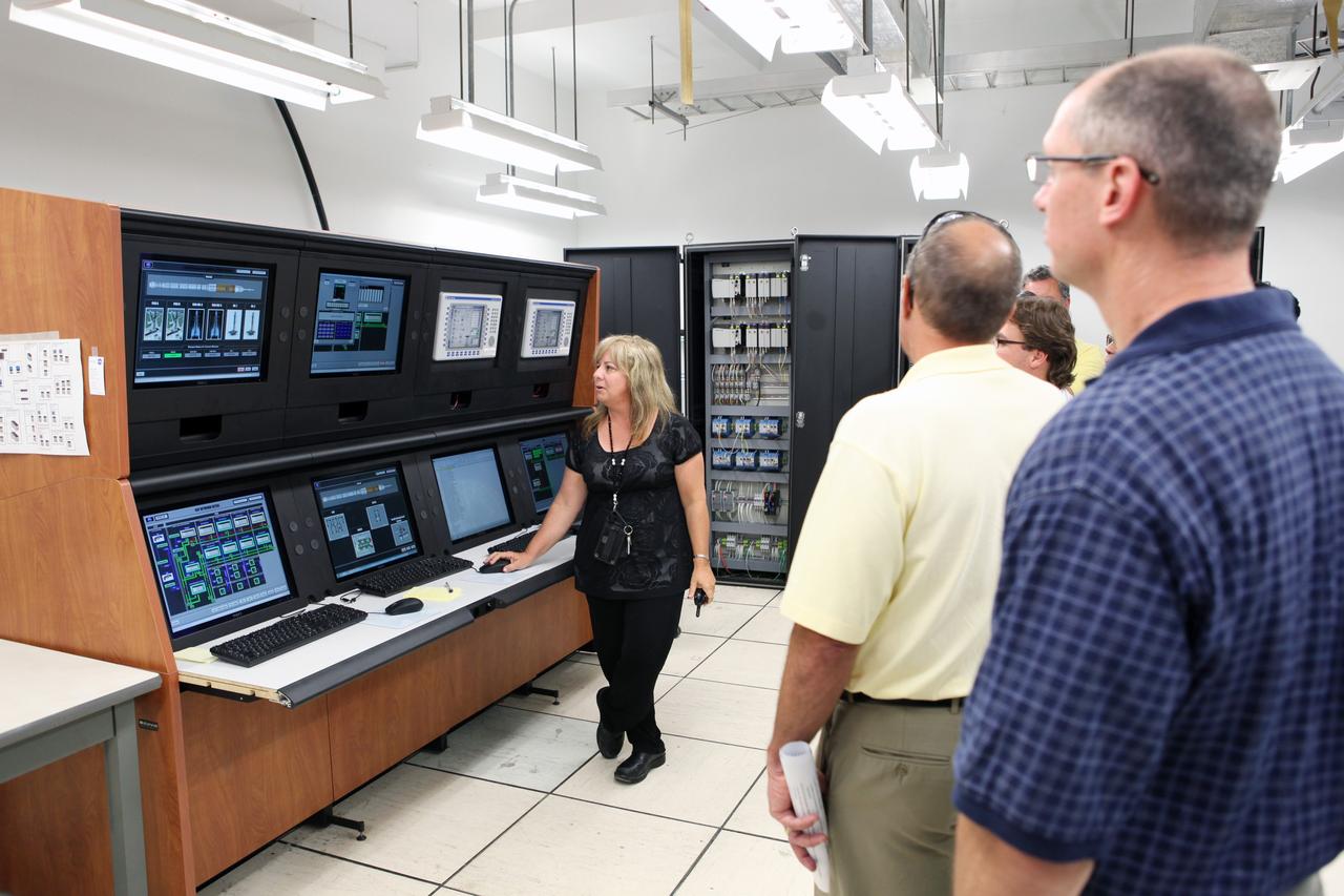 CAPE CANAVERAL, Fla. – Workers at NASA's Kennedy Space Center watch a demonstration of new systems installed in Launch Pad 39B. The renovation has been led by the Ground Systems Development and Operations Program based at Kennedy. The new systems are designed to be flexible so controllers can process and launch multiple types of rockets and spacecraft, whether they are government or commercial models. Photo credit: NASA/Dmitri Gerondidakis
