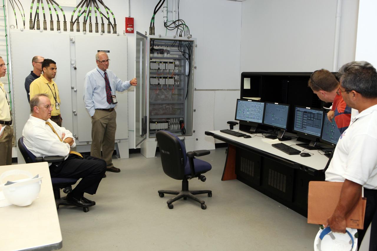 CAPE CANAVERAL, Fla. – Workers at NASA's Kennedy Space Center watch a demonstration of new systems installed in Launch Pad 39B. The renovation has been led by the Ground Systems Development and Operations Program based at Kennedy. The new systems are designed to be flexible so controllers can process and launch multiple types of rockets and spacecraft, whether they are government or commercial models. Photo credit: NASA/Dmitri Gerondidakis