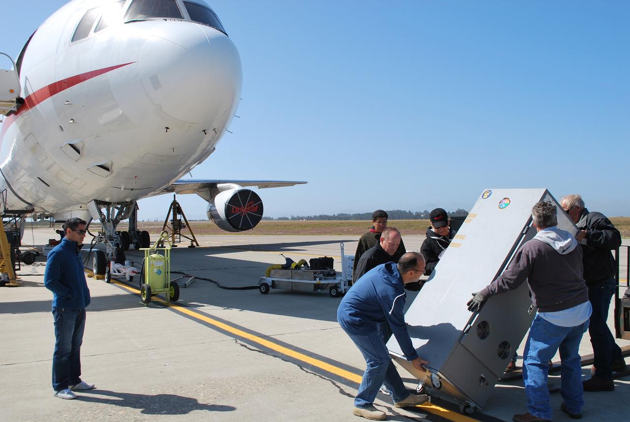 VANDENBERG AIR FORCE BASE, Calif. -- Technicians transfer the spacecraft airborne support equipment to the Orbital Sciences' L-1011 carrier aircraft. This equipment will maintain the in-flight monitoring and control of the NuSTAR spacecraft before the release of the Pegasus XL rocket.        The Pegasus will launch NuSTAR into space where the high-energy x-ray telescope will conduct a census for black holes, map radioactive material in young supernovae remnants, and study the origins of cosmic rays and the extreme physics around collapsed stars. For more information, visit science.nasa.gov/missions/nustar/. Photo credit: NASA/Randy Beaudoin, VAFB