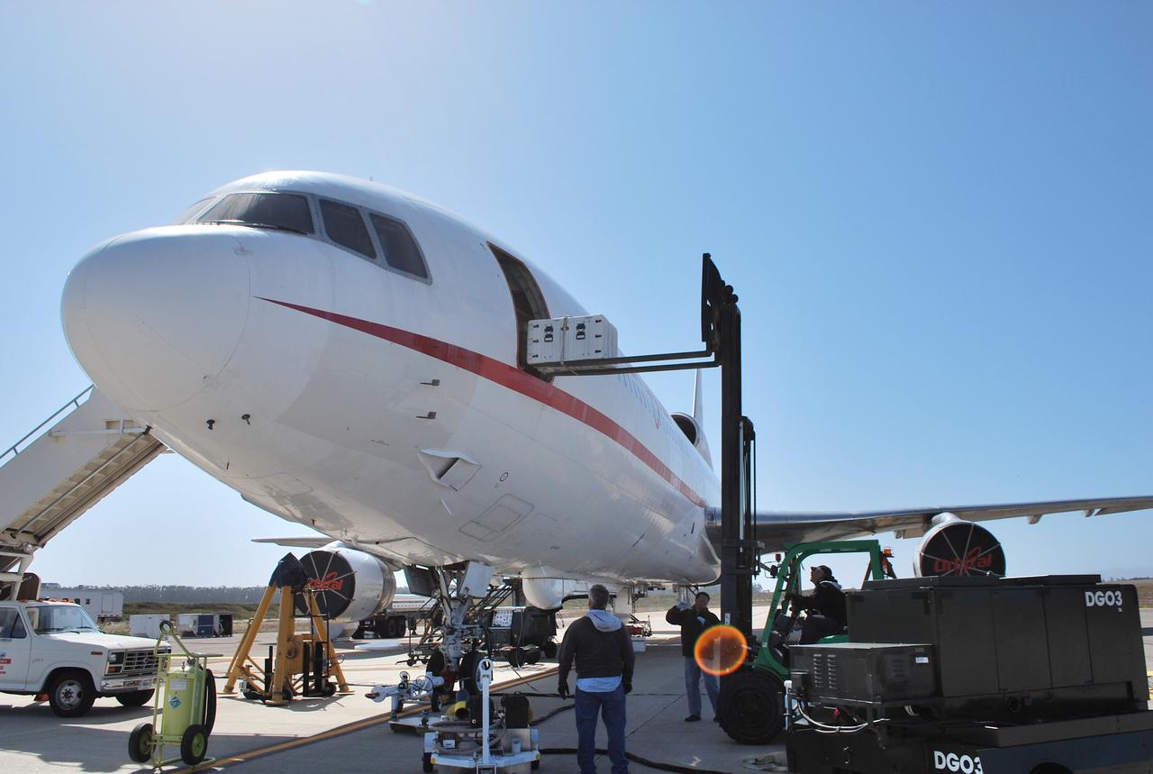 VANDENBERG AIR FORCE BASE, Calif. -- Technicians load the spacecraft airborne support equipment to the Orbital Sciences' L-1011 carrier aircraft. This equipment will maintain the in-flight monitoring and control of the NuSTAR spacecraft before the release of the Pegasus XL rocket.      The Pegasus will launch NuSTAR into space where the high-energy x-ray telescope will conduct a census for black holes, map radioactive material in young supernovae remnants, and study the origins of cosmic rays and the extreme physics around collapsed stars. For more information, visit science.nasa.gov/missions/nustar/. Photo credit: NASA/Randy Beaudoin, VAFB