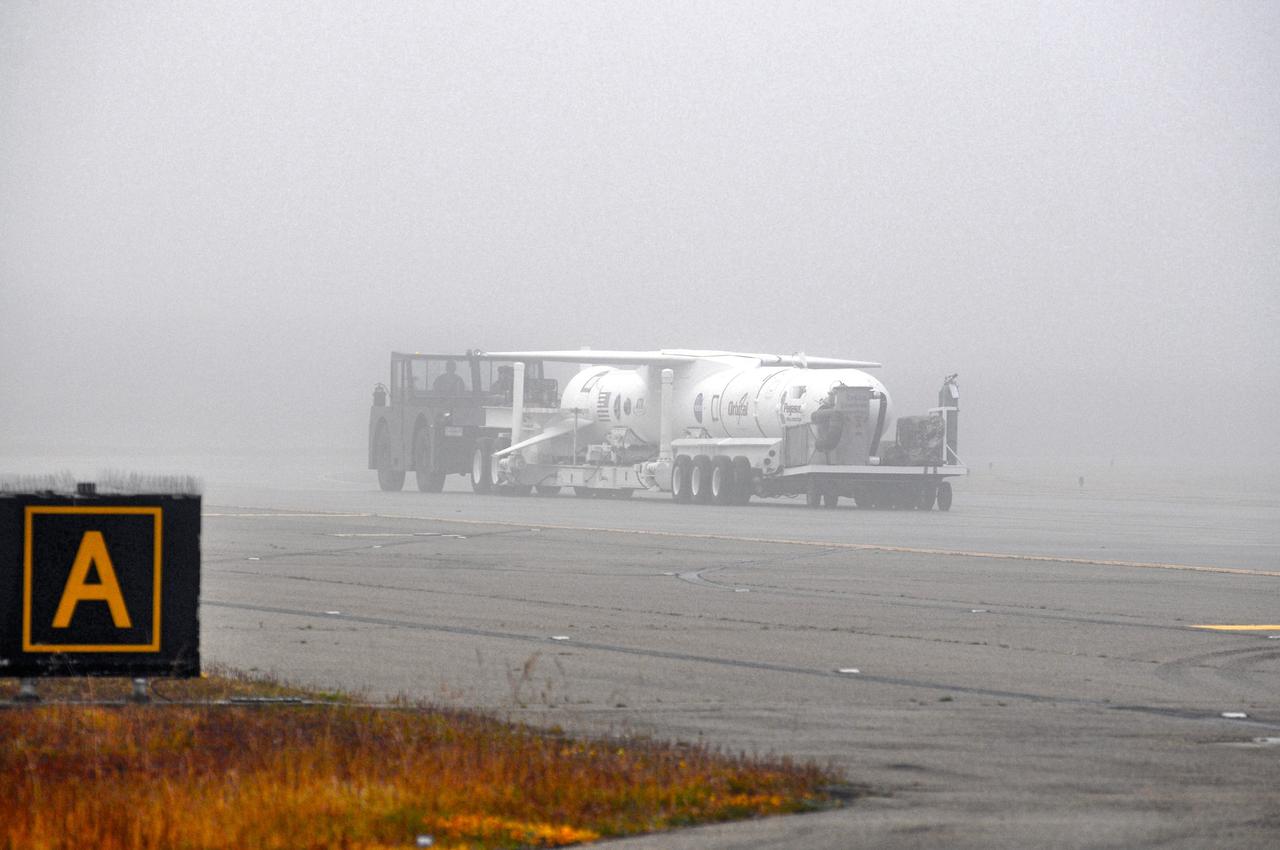 VANDENBERG AFB, Calif. – Technicians roll the Orbital Sciences Pegasus XL rocket with its NuSTAR spacecraft to the waiting L-1011 carrier aircraft known as "Stargazer." The Pegasus will launch NuSTAR into space where the high-energy x-ray telescope will conduct a census for black holes, map radioactive material in young supernovae remnants, and study the origins of cosmic rays and the extreme physics around collapsed stars. Photo credit: NASA/Randy Beaudoin, VAFB
