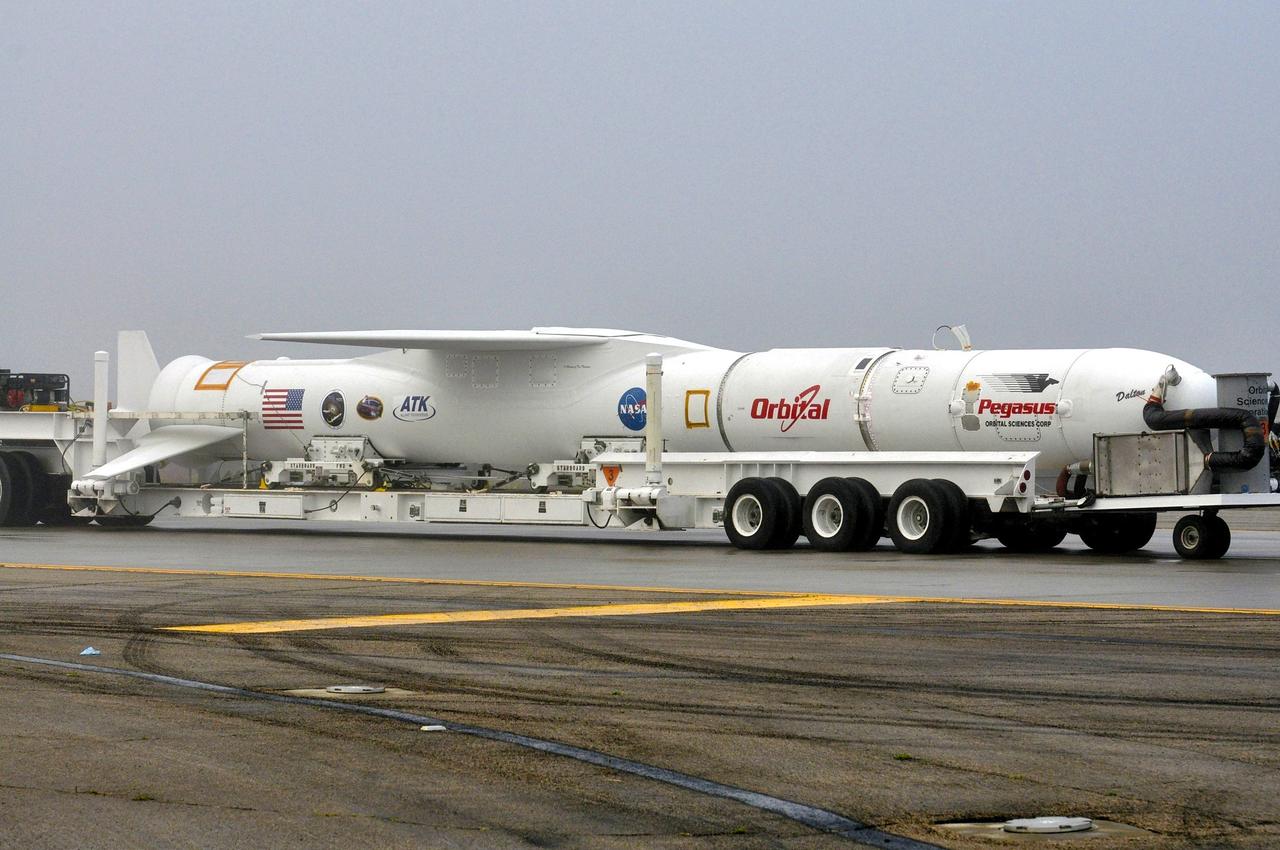 VANDENBERG AFB, Calif. – Technicians roll the Orbital Sciences Pegasus XL rocket with its NuSTAR spacecraft to the waiting L-1011 carrier aircraft known as "Stargazer." The Pegasus will launch NuSTAR into space where the high-energy x-ray telescope will conduct a census for black holes, map radioactive material in young supernovae remnants, and study the origins of cosmic rays and the extreme physics around collapsed stars. Photo credit: NASA/Randy Beaudoin, VAFB