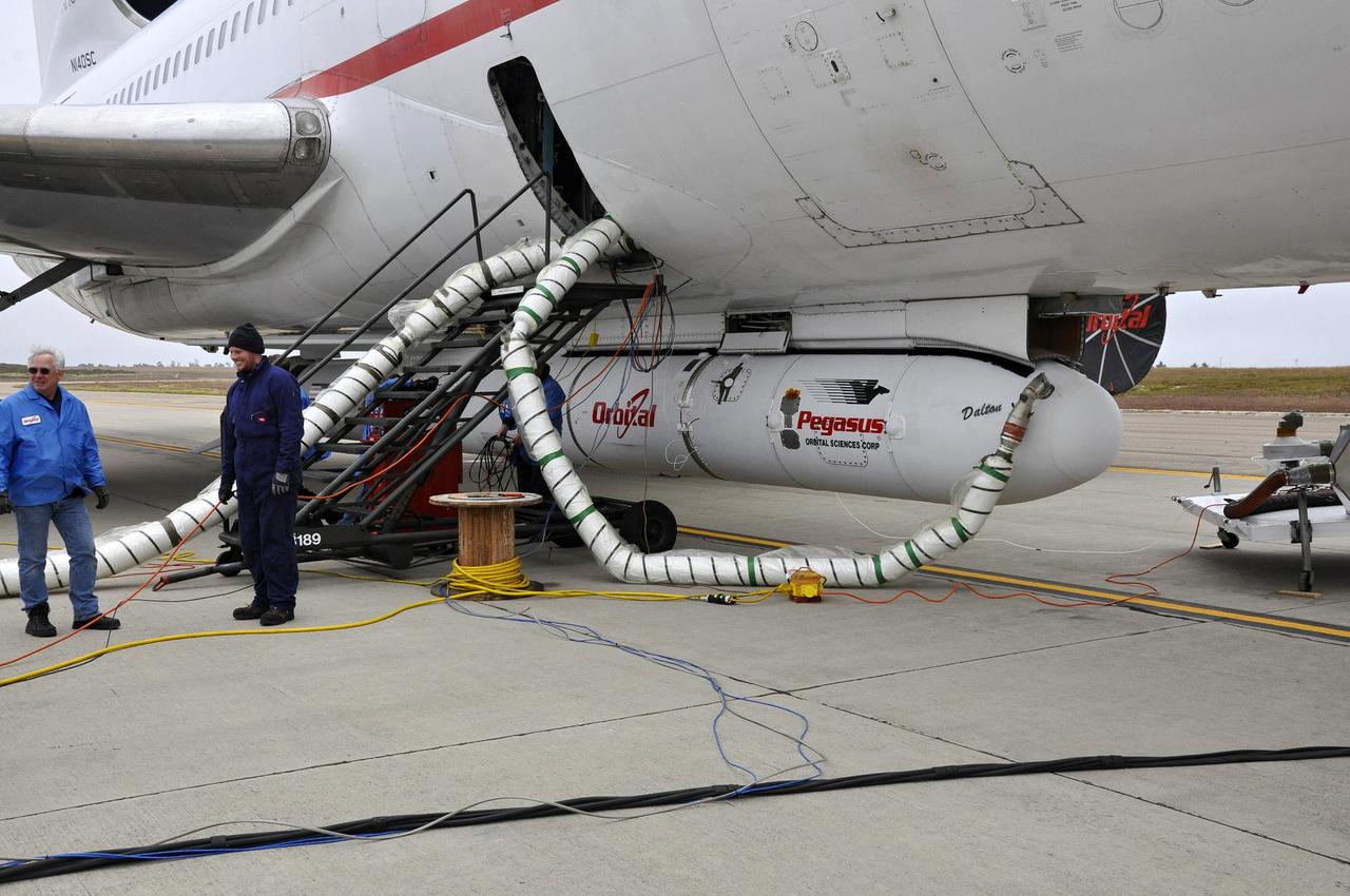 VANDENBERG AFB, Calif. – Technicians connect the Orbital Sciences Pegasus XL rocket with its NuSTAR spacecraft to the L-1011 carrier aircraft known as "Stargazer." The Pegasus will launch NuSTAR into space where the high-energy x-ray telescope will conduct a census for black holes, map radioactive material in young supernovae remnants, and study the origins of cosmic rays and the extreme physics around collapsed stars. Photo credit: NASA/Randy Beaudoin, VAFB