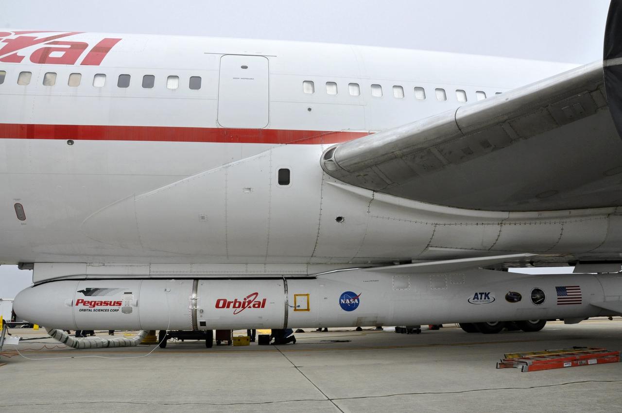 VANDENBERG AFB, Calif. – The Orbital Sciences Pegasus XL rocket with its NuSTAR spacecraft after attachment to the L-1011 carrier aircraft known as "Stargazer." The Pegasus will launch NuSTAR into space where the high-energy x-ray telescope will conduct a census for black holes, map radioactive material in young supernovae remnants, and study the origins of cosmic rays and the extreme physics around collapsed stars. Photo credit: NASA/Randy Beaudoin, VAFB