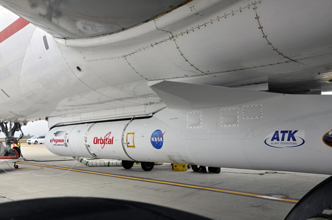 VANDENBERG AFB, Calif. – The Orbital Sciences Pegasus XL rocket with its NuSTAR spacecraft after attachment to the L-1011 carrier aircraft known as "Stargazer." The Pegasus will launch NuSTAR into space where the high-energy x-ray telescope will conduct a census for black holes, map radioactive material in young supernovae remnants, and study the origins of cosmic rays and the extreme physics around collapsed stars. Photo credit: NASA/Randy Beaudoin, VAFB