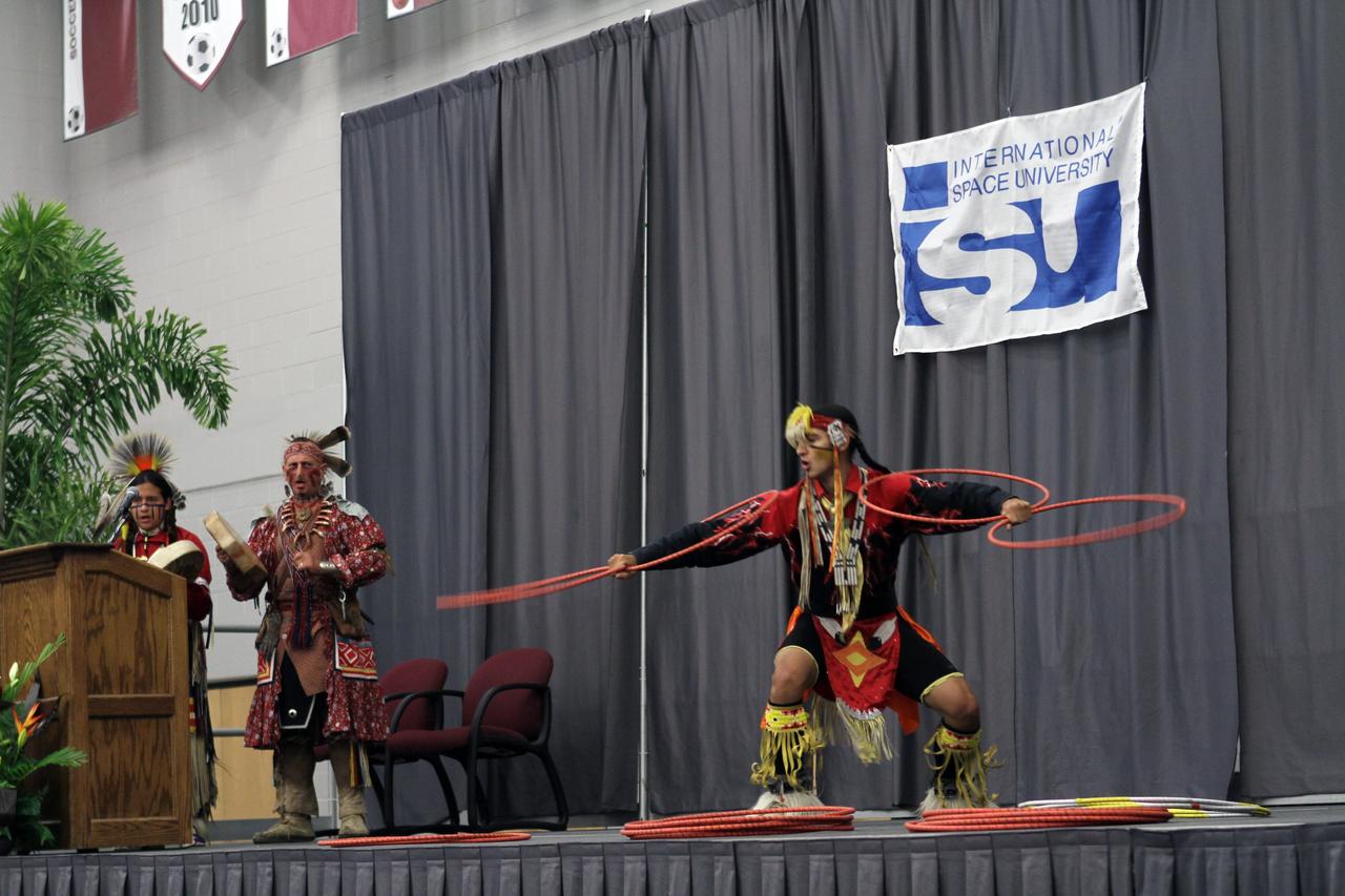MELBOURNE, Fla. – Entertainment during the opening ceremonies for the International Space University's 25th annual Space Studies Program session at the Florida Institute of Technology in Melbourne, Fla., is provided by Jim Sawgrass and the Deep Forest Native American Indian Program dancers.     The nine-week intensive course is designed for post-graduate university students and professionals during the summer. The program is hosted by a different country each year, providing a unique educational experience for participants from around the globe. NASA Kennedy Space Center and Florida Tech are co-hosting this year's event which runs from June 4 to Aug. 3. This year, there are about 125 participants representing 31 countries. For more information, visit http://www.isunet.edu.  Photo credit: NASA/Kim Shiflett