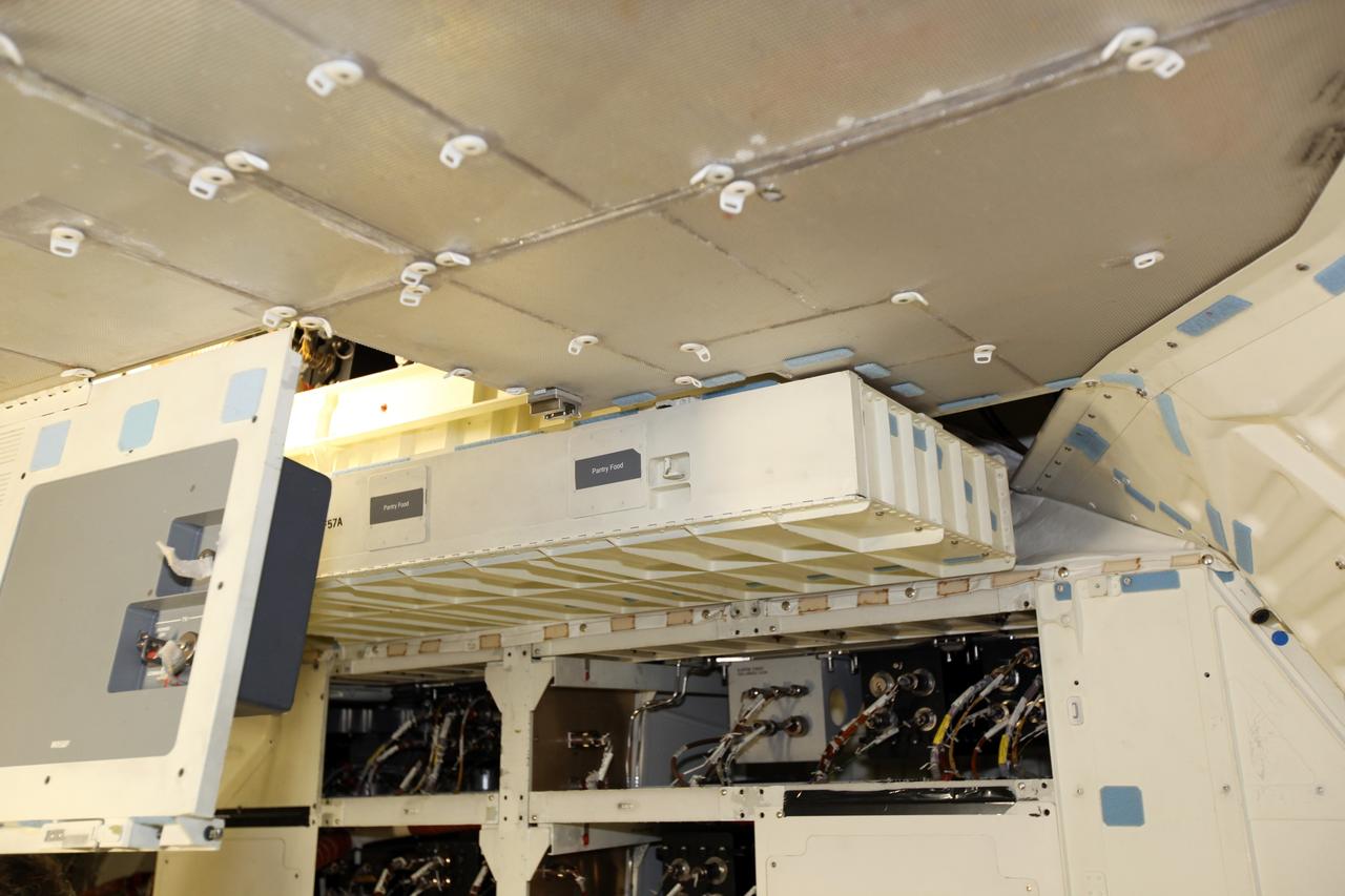 A locker installed on the middeck of space shuttle Atlantis as the spacecraft is prepared for public display. The work is taking place as Atlantis sits inside Orbiter Processing Facility-1 at NASA's Kennedy Space Center in Florida. Photo credit: NASA/Dmitri Gerondidakis