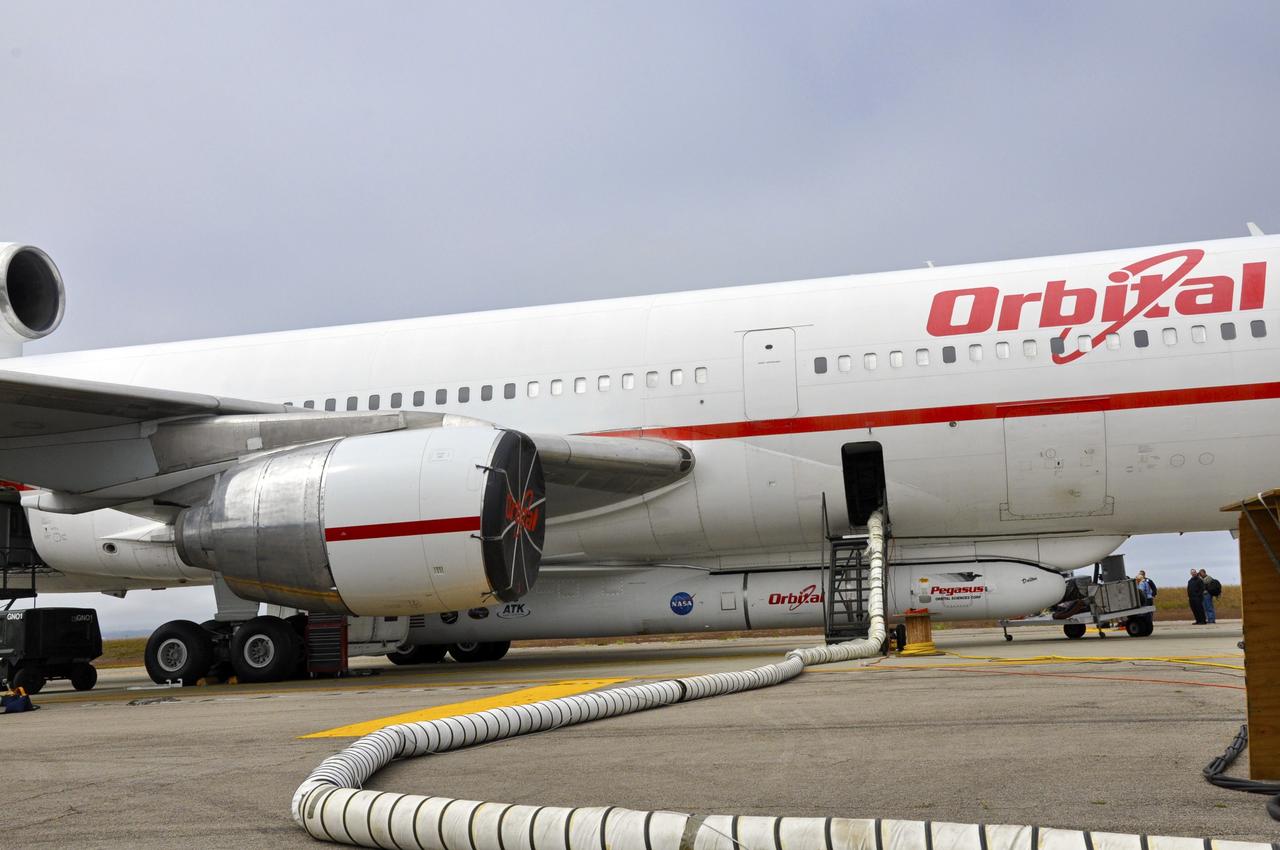 VANDENBERG AIR FORCE BASE, Calif. – An Orbital Sciences’ Pegasus rocket and NASA’s Nuclear Spectroscopic Telescope Array, or NuSTAR, are installed under Orbital’s L-1011 carrier aircraft and await departure  from Vandenberg Air Force Base in California for the U.S. Army's Ronald Reagan Ballistic Missile Defense Test Site on Kwajalein Atoll, part of the Marshall Islands in the Pacific Ocean.     The Pegasus, mated to its NuSTAR payload, will be launched from the carrier aircraft 117 nautical miles south of Kwajalein at latitude 6.75 degrees north of the equator.  The high-energy X-ray telescope will conduct a census of black holes, map radioactive material in young supernovae remnants, and study the origins of cosmic rays and the extreme physics around collapsed stars. Launch is scheduled for June 13.  For more information, visit http://www.nasa.gov/nustar.  Photo credit: NASA/Randy Beaudoin, VAFB