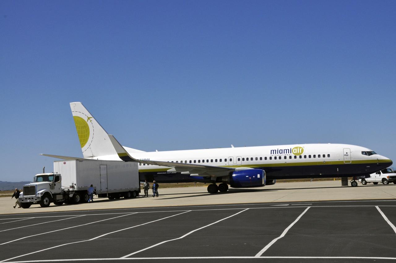 VANDENBERG AIR FORCE BASE, Calif. – Supplies are loaded onto the Miami Air International Boeing 737 airplane that will accompany Orbital Sciences’ L-1011 carrier aircraft from Vandenberg Air Force Base in California to the U.S. Army's Ronald Reagan Ballistic Missile Defense Test Site on Kwajalein Atoll, part of the Marshall Islands in the Pacific Ocean.  Forty-nine passengers, including the launch team, are traveling to Kwajalein aboard the charter flight.  The launch team is made up of employees of NASA, Orbital Sciences and a.i. solutions.    The Pegasus, mated to its NuSTAR payload, will be launched from the carrier aircraft 117 nautical miles south of Kwajalein at latitude 6.75 degrees north of the equator.  The high-energy X-ray telescope will conduct a census of black holes, map radioactive material in young supernovae remnants, and study the origins of cosmic rays and the extreme physics around collapsed stars. Launch is scheduled for June 13.  For more information, visit http://www.nasa.gov/nustar.  Photo credit: NASA/Randy Beaudoin, VAFB