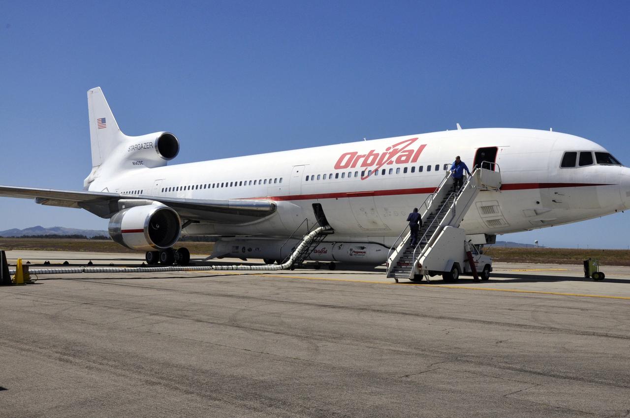 VANDENBERG AIR FORCE BASE, Calif. – The flight crew boards Orbital Sciences’ L-1011 carrier aircraft at Vandenberg Air Force Base in California.  The aircraft is transporting Orbital’s Pegasus rocket and NASA’s Nuclear Spectroscopic Telescope Array, or NuSTAR, to the U.S. Army's Ronald Reagan Ballistic Missile Defense Test Site on Kwajalein Atoll, part of the Marshall Islands in the Pacific Ocean.     The Pegasus, mated to its NuSTAR payload, will be launched from the carrier aircraft 117 nautical miles south of Kwajalein at latitude 6.75 degrees north of the equator.  The high-energy X-ray telescope will conduct a census of black holes, map radioactive material in young supernovae remnants, and study the origins of cosmic rays and the extreme physics around collapsed stars. Launch is scheduled for June 13.  For more information, visit http://www.nasa.gov/nustar.  Photo credit: NASA/Randy Beaudoin, VAFB