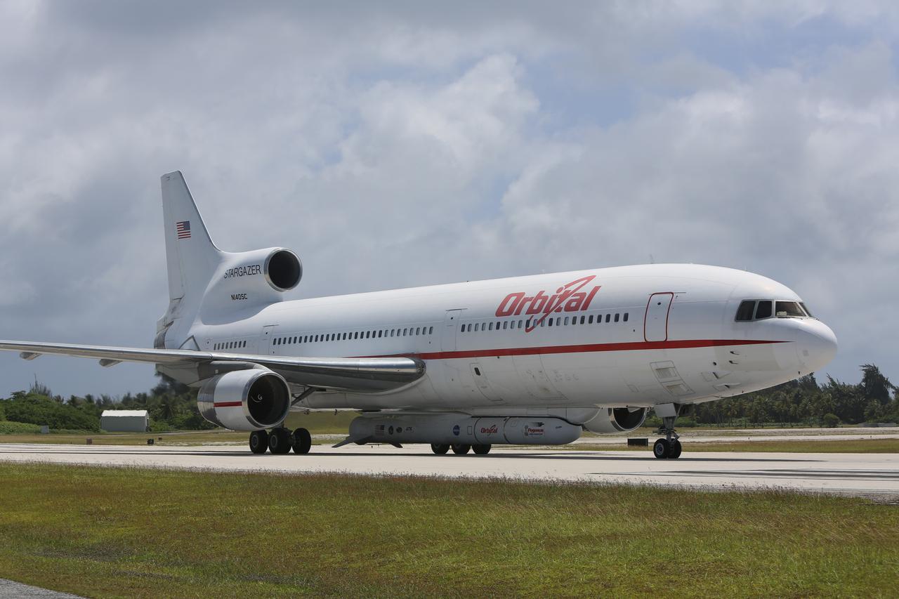 KWAJALEIN ATOLL, Marshall Islands – An Orbital Sciences’ Pegasus rocket and NASA’s Nuclear Spectroscopic Telescope Array, or NuSTAR, are delivered to the U.S. Army's Ronald Reagan Ballistic Missile Defense Test Site on Kwajalein Atoll secured beneath Orbital’s L-1011 carrier aircraft.      The Pegasus, mated to its NuSTAR payload, will be launched from the carrier aircraft 117 nautical miles south of Kwajalein at latitude 6.75 degrees north of the equator.  The high-energy X-ray telescope will conduct a census of black holes, map radioactive material in young supernovae remnants, and study the origins of cosmic rays and the extreme physics around collapsed stars. Launch and deployment of the telescope is scheduled for June 13.  For more information, visit http://www.nasa.gov/nustar.  Photo courtesy of Orbital Sciences Corp.