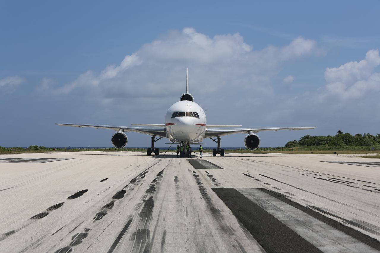 KWAJALEIN ATOLL, Marshall Islands – Orbital Sciences' L-1011 carrier aircraft has arrived at the U.S. Army's Ronald Reagan Ballistic Missile Defense Test Site on Kwajalein Atoll, delivering Orbital’s Pegasus rocket and NASA’s Nuclear Spectroscopic Telescope Array, or NuSTAR, from Vandenberg Air Force Base in California.    The Pegasus, mated to its NuSTAR payload, will be launched from the carrier aircraft 117 nautical miles south of Kwajalein at latitude 6.75 degrees north of the equator.  The high-energy X-ray telescope will conduct a census of black holes, map radioactive material in young supernovae remnants, and study the origins of cosmic rays and the extreme physics around collapsed stars. Launch and deployment of the telescope is scheduled for June 13.  For more information, visit http://www.nasa.gov/nustar.  Photo courtesy of Orbital Sciences Corp.