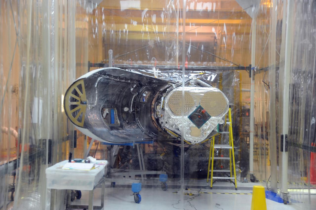 VANDENBERG AIR FORCE BASE, Calif. – Preparations are under way in Orbital Sciences’ hangar on Vandenberg Air Force Base in California to reinstall the Pegasus fairing around NASA’s Nuclear Spectroscopic Telescope Array, or NuSTAR.       Access to the spacecraft was needed for compatibility testing to verify communication with a tracking station in Hawaii. With the change in the launch timeframe to June, this station will be needed to support launch.  After processing of Orbital’s Pegasus XL rocket and the spacecraft is complete, they will be flown on Orbital's L-1011 carrier aircraft from Vandenberg, to the U.S. Army's Ronald Reagan Ballistic Missile Defense Test Site on Kwajalein Atoll, part of the Marshall Islands in the Pacific Ocean.  The Pegasus, mated to its NuSTAR payload, will be launched from the carrier aircraft 117 nautical miles south of Kwajalein at latitude 6.75 degrees north of the equator.  The high-energy X-ray telescope will conduct a census of black holes, map radioactive material in young supernovae remnants, and study the origins of cosmic rays and the extreme physics around collapsed stars. Launch is scheduled for June 13.  For more information, visit http://www.nasa.gov/nustar.  Photo credit: U.S. Air Force 30th Space Wing/Aaron Taubman, VAFB