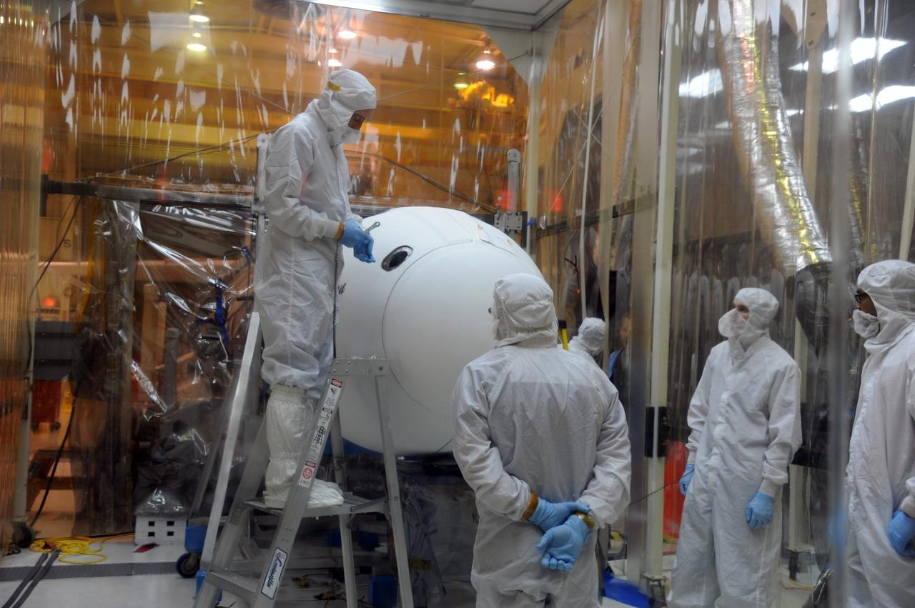 VANDENBERG AIR FORCE BASE, Calif. – In Orbital Sciences’ hangar on Vandenberg Air Force Base in California, the Pegasus fairing has been secured around NASA’s Nuclear Spectroscopic Telescope Array, or NuSTAR.      Access to the spacecraft was needed for compatibility testing to verify communication with a tracking station in Hawaii. With the change in the launch timeframe to June, this station will be needed to support launch.  After processing of Orbital’s Pegasus XL rocket and the spacecraft is complete, they will be flown on Orbital's L-1011 carrier aircraft from Vandenberg, to the U.S. Army's Ronald Reagan Ballistic Missile Defense Test Site on Kwajalein Atoll, part of the Marshall Islands in the Pacific Ocean.  The Pegasus, mated to its NuSTAR payload, will be launched from the carrier aircraft 117 nautical miles south of Kwajalein at latitude 6.75 degrees north of the equator.  The high-energy X-ray telescope will conduct a census of black holes, map radioactive material in young supernovae remnants, and study the origins of cosmic rays and the extreme physics around collapsed stars. Launch is scheduled for June 13.  For more information, visit http://www.nasa.gov/nustar.  Photo credit: U.S. Air Force 30th Space Wing/Aaron Taubman, VAFB