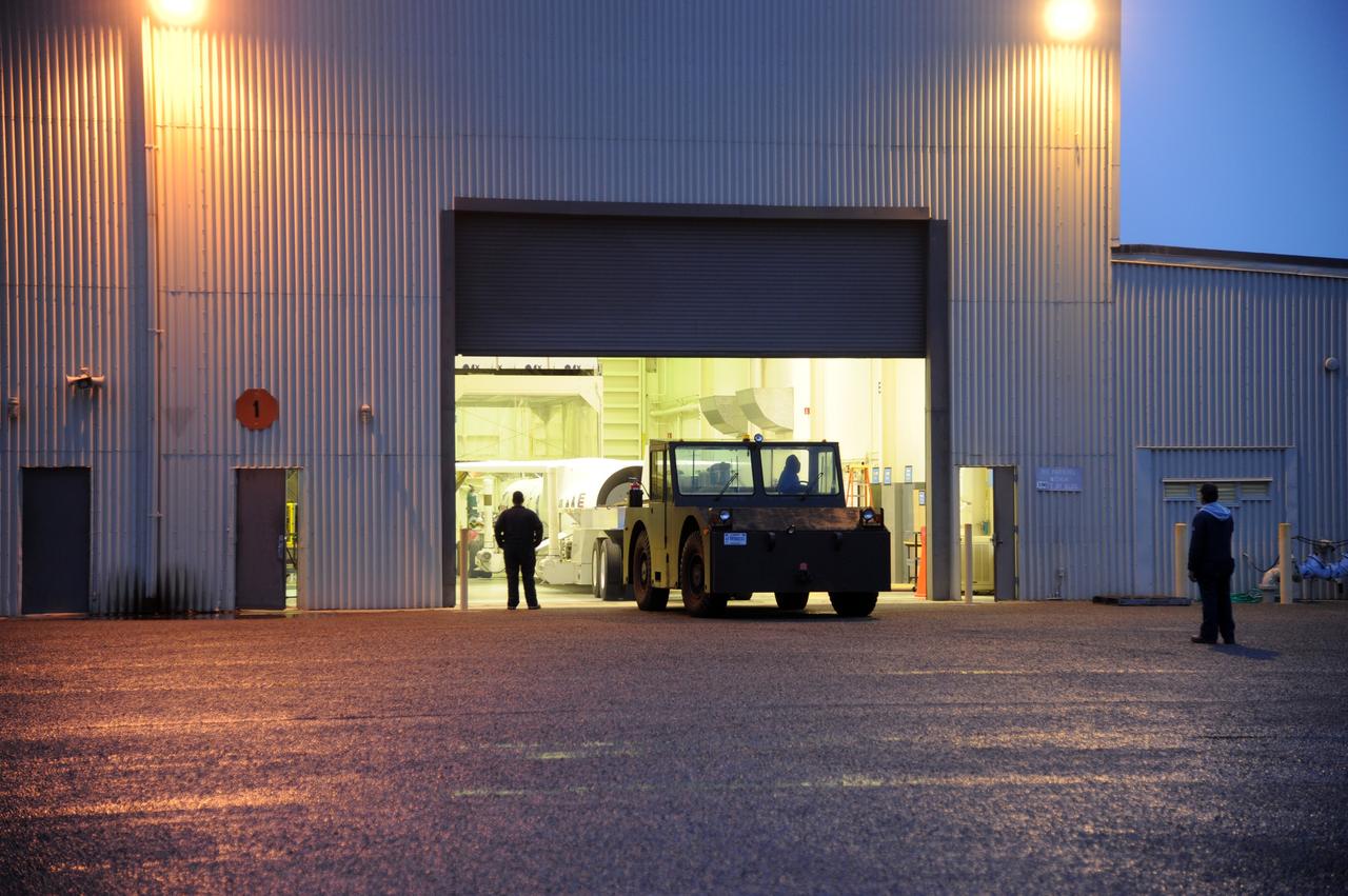 VANDENBERG AIR FORCE BASE, Calif. – NASA’s Nuclear Spectroscopic Telescope Array, or NuSTAR, mated to Orbital Sciences’ Pegasus XL rocket, begins its move from Orbital’s processing hangar to the “hot pad,” located on the ramp adjacent to the runway on Vandenberg Air Force Base in California.  At the hot pad, the rocket will be attached beneath Orbital’s L-1011 carrier aircraft.    The duo will be flown from Vandenberg to the U.S. Army's Ronald Reagan Ballistic Missile Defense Test Site on Kwajalein Atoll, part of the Marshall Islands in the Pacific Ocean.  The Pegasus and its NuSTAR payload will be launched June 13 from the carrier aircraft 117 nautical miles south of Kwajalein at latitude 6.75 degrees north of the equator.  The high-energy X-ray telescope will conduct a census of black holes, map radioactive material in young supernovae remnants, and study the origins of cosmic rays and the extreme physics around collapsed stars. For more information, visit http://www.nasa.gov/nustar.  Photo credit: NASA/Chris Wiant, VAFB