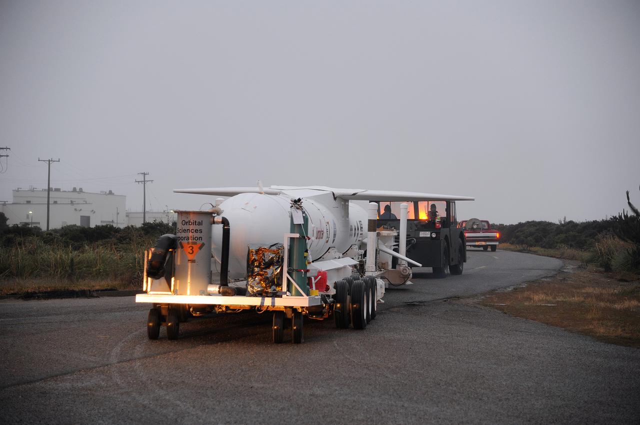 VANDENBERG AIR FORCE BASE, Calif. – NASA’s Nuclear Spectroscopic Telescope Array, or NuSTAR, mated to Orbital Sciences’ Pegasus XL rocket, makes its way from Orbital’s processing hangar to the “hot pad,” located on the ramp adjacent to the runway on Vandenberg Air Force Base in California.  At the hot pad, the rocket will be attached beneath Orbital’s L-1011 carrier aircraft.      The duo will be flown from Vandenberg to the U.S. Army's Ronald Reagan Ballistic Missile Defense Test Site on Kwajalein Atoll, part of the Marshall Islands in the Pacific Ocean.  The Pegasus and its NuSTAR payload will be launched June 13 from the carrier aircraft 117 nautical miles south of Kwajalein at latitude 6.75 degrees north of the equator.  The high-energy X-ray telescope will conduct a census of black holes, map radioactive material in young supernovae remnants, and study the origins of cosmic rays and the extreme physics around collapsed stars. For more information, visit http://www.nasa.gov/nustar.  Photo credit: NASA/Chris Wiant, VAFB