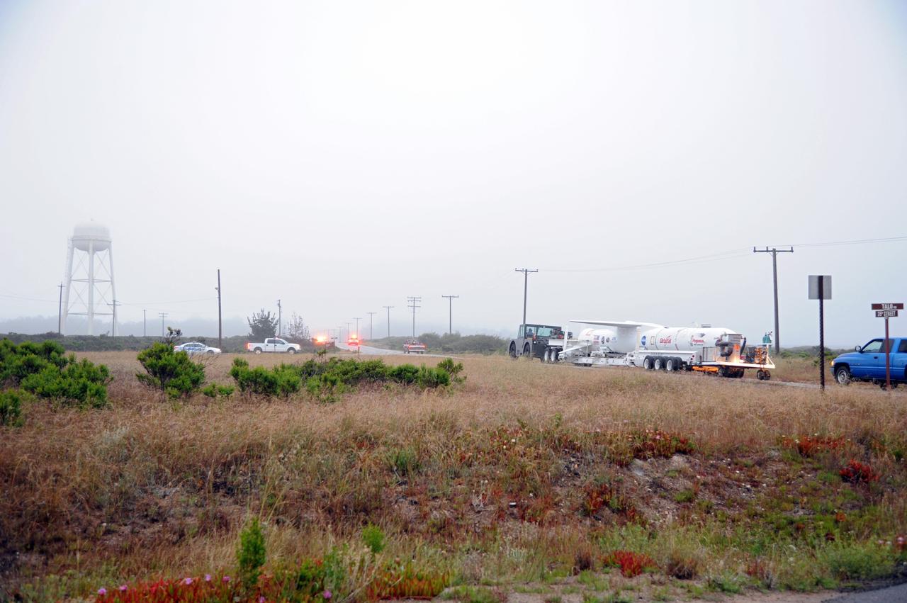 VANDENBERG AIR FORCE BASE, Calif. – The sun rises over Vandenberg Air Force Base in California to reveal NASA’s Nuclear Spectroscopic Telescope Array, or NuSTAR, mated to Orbital Sciences’ Pegasus XL rocket, making its way from Orbital’s processing hangar to the “hot pad,” located on the ramp adjacent to the runway on.  At the hot pad, the rocket will be attached beneath Orbital’s L-1011 carrier aircraft.      The duo will be flown from Vandenberg to the U.S. Army's Ronald Reagan Ballistic Missile Defense Test Site on Kwajalein Atoll, part of the Marshall Islands in the Pacific Ocean.  The Pegasus and its NuSTAR payload will be launched June 13 from the carrier aircraft 117 nautical miles south of Kwajalein at latitude 6.75 degrees north of the equator.  The high-energy X-ray telescope will conduct a census of black holes, map radioactive material in young supernovae remnants, and study the origins of cosmic rays and the extreme physics around collapsed stars. For more information, visit http://www.nasa.gov/nustar.  Photo credit: NASA/Chris Wiant, VAFB