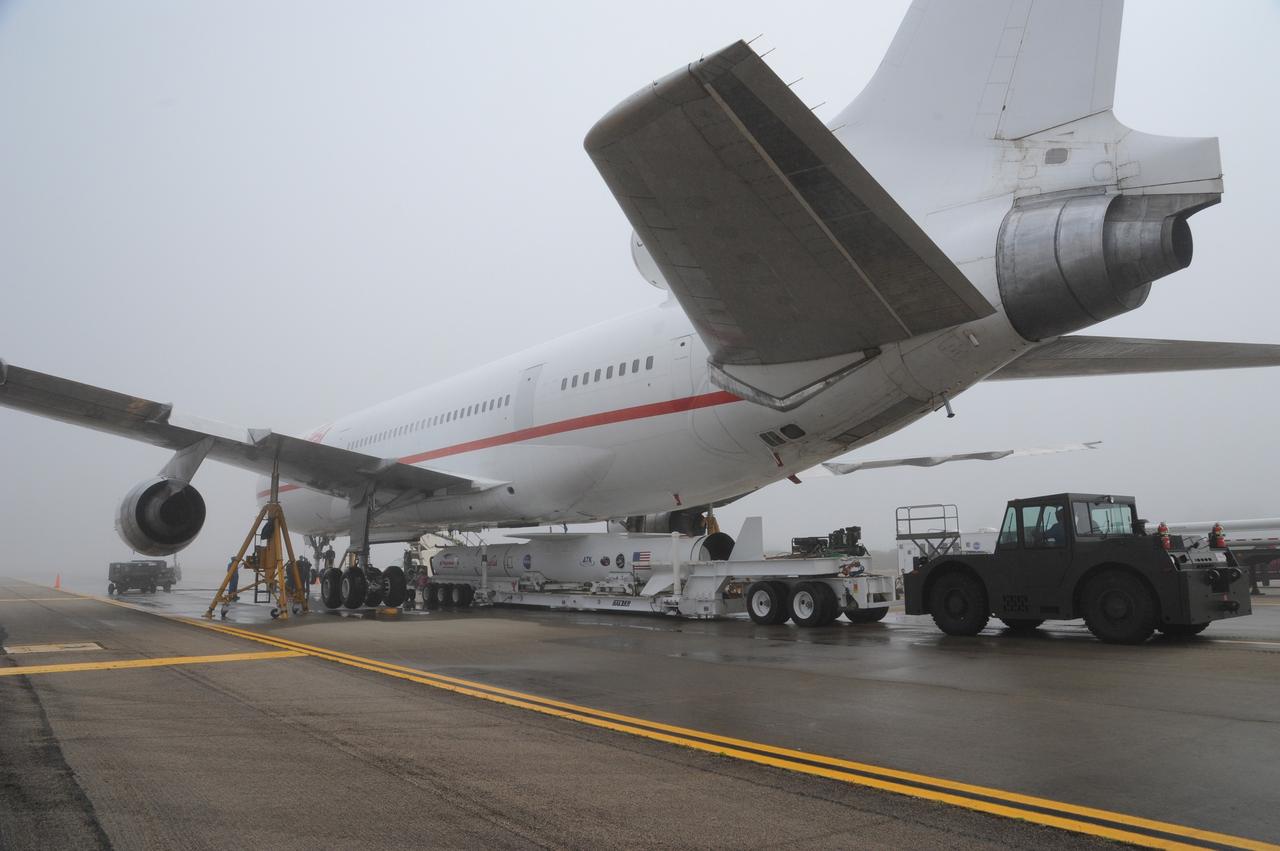 VANDENBERG AIR FORCE BASE, Calif. – NASA’s Nuclear Spectroscopic Telescope Array, or NuSTAR, mated to Orbital Sciences’ Pegasus XL rocket, is positioned under Orbital’s L-1011 carrier aircraft at the “hot pad,” located on the ramp adjacent to the runway on Vandenberg Air Force Base in California.  Operations are under way to attach the rocket beneath the L-1011 aircraft.    The duo will be flown from Vandenberg to the U.S. Army's Ronald Reagan Ballistic Missile Defense Test Site on Kwajalein Atoll, part of the Marshall Islands in the Pacific Ocean.  The Pegasus and its NuSTAR payload will be launched June 13 from the carrier aircraft 117 nautical miles south of Kwajalein at latitude 6.75 degrees north of the equator.  The high-energy X-ray telescope will conduct a census of black holes, map radioactive material in young supernovae remnants, and study the origins of cosmic rays and the extreme physics around collapsed stars. For more information, visit http://www.nasa.gov/nustar.  Photo credit: NASA/Chris Wiant, VAFB