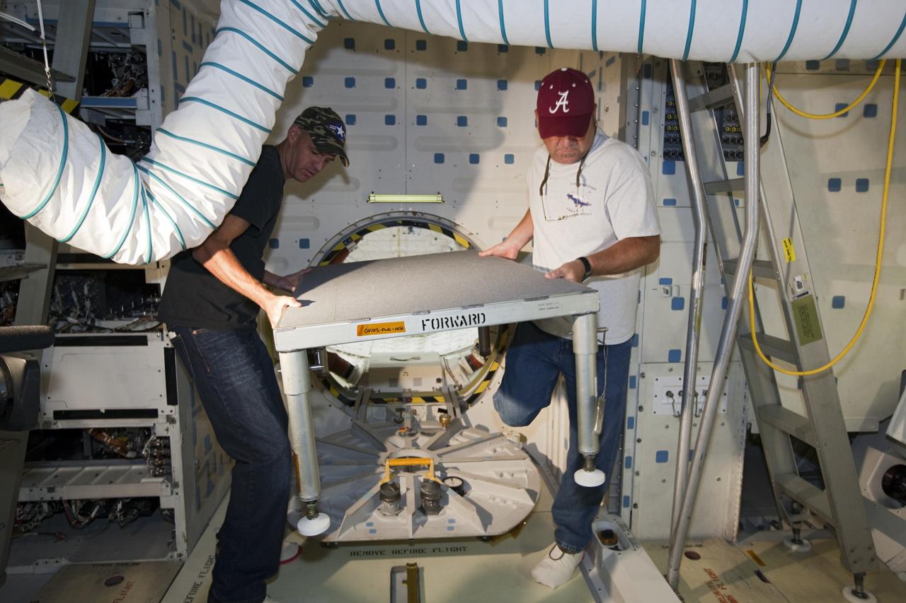 CAPE CANAVERAL, Fla. – In Orbiter Processing Facility-2 at NASA’s Kennedy Space Center in Florida, United Space Alliance technicians clear the area in front of space shuttle Endeavour’s airlock before its hatch is closed for the final time during processing for the shuttle’s retirement. Endeavour is being prepared for public display at the California Science Center in Los Angeles. Its ferry flight to California is targeted for mid-September. Endeavour, designated OV-105, was the last space shuttle added to NASA’s orbiter fleet. Over the course of its 19-year career, Endeavour spent 299 days in space during 25 missions. For more information, visit http://www.nasa.gov/transition. Photo credit: NASA/Dimitri Gerondidakis