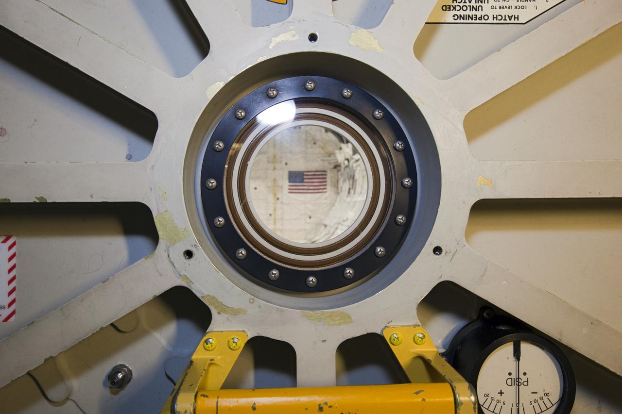 CAPE CANAVERAL, Fla. – In Orbiter Processing Facility-2 at NASA’s Kennedy Space Center in Florida, the camera captures a final view through space shuttle Endeavour’s airlock hatch into the payload bay after the hatch is closed for the final time during processing for the shuttle’s retirement. Endeavour is being prepared for public display at the California Science Center in Los Angeles. Its ferry flight to California is targeted for mid-September. Endeavour, designated OV-105, was the last space shuttle added to NASA’s orbiter fleet. Over the course of its 19-year career, Endeavour spent 299 days in space during 25 missions. For more information, visit http://www.nasa.gov/transition. Photo credit: NASA/Dimitri Gerondidakis