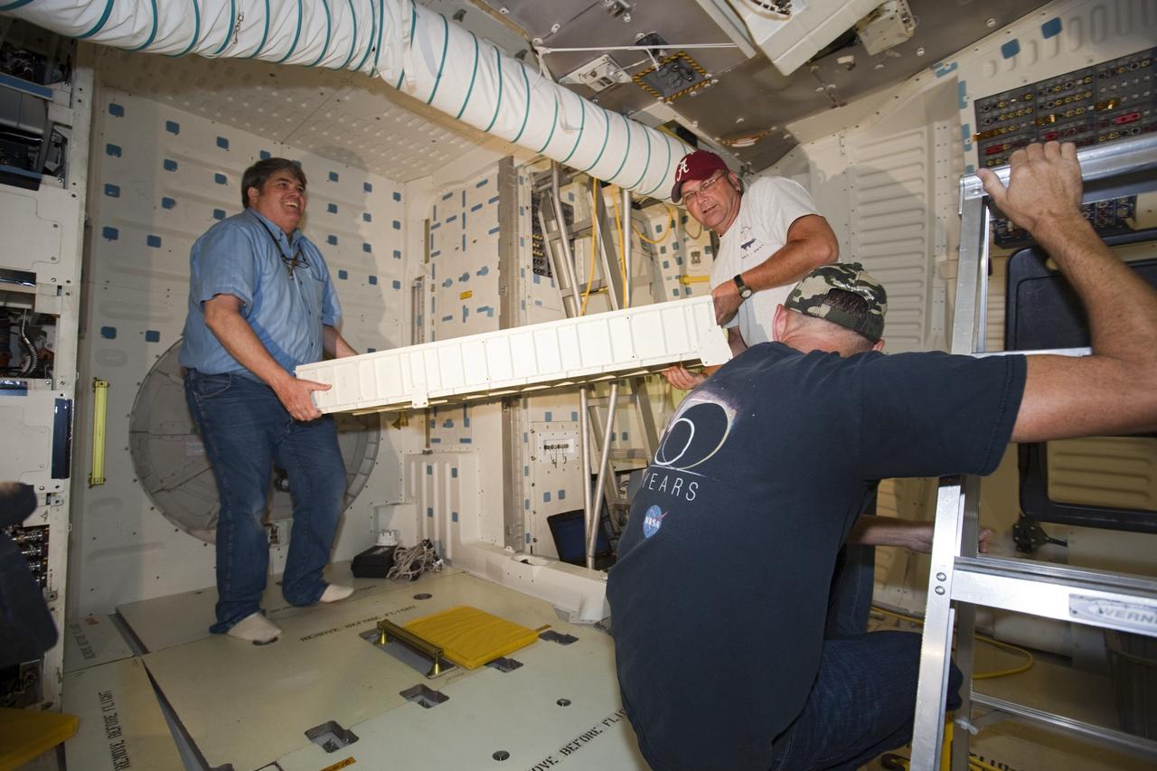 CAPE CANAVERAL, Fla. – In Orbiter Processing Facility-2 at NASA’s Kennedy Space Center in Florida, United Space Alliance technicians reinstall the food pantry locker in space shuttle Endeavour’s middeck during processing for the shuttle’s retirement. Endeavour is being prepared for public display at the California Science Center in Los Angeles. Its ferry flight to California is targeted for mid-September. Endeavour, designated OV-105, was the last space shuttle added to NASA’s orbiter fleet. Over the course of its 19-year career, Endeavour spent 299 days in space during 25 missions. For more information, visit http://www.nasa.gov/transition. Photo credit: NASA/Dimitri Gerondidakis