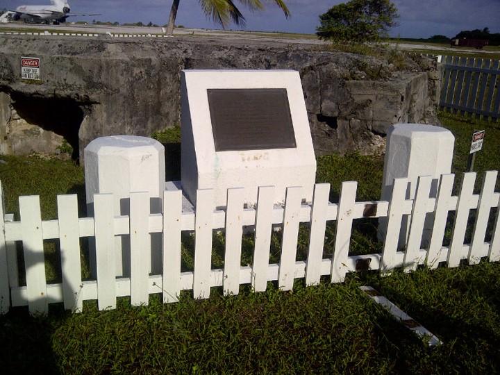 KWAJALEIN ATOLL, Marshall Islands - Orbital Science Corp.'s L-1011 aircraft "Stargazer" stands near the runway on Kwajalein Atoll with the company's Pegasus rocket slung underneath in the background near this World War II-era bunker built by the Japanese forces who occupied the island. Photo credit: NASA