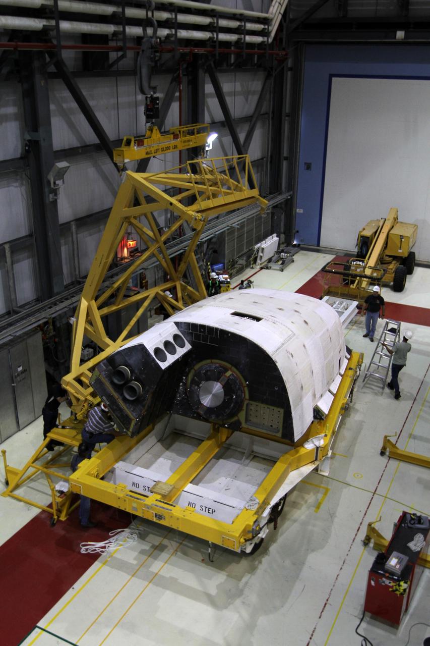 CAPE CANAVERAL, Fla. – In Orbiter Processing Facility-1 at NASA’s Kennedy Space Center in Florida, preparations are under way to lift an orbital maneuvering system, or OMS, pod from its transporter. The pod will be reinstalled on space shuttle Atlantis. The orbital maneuvering system provided the shuttle with thrust for orbit insertion, rendezvous and deorbit, and could provide up to 1,000 pounds of propellant to the aft reaction control system. The OMS is housed in two independent pods located on each side of the shuttle's aft fuselage. Each pod contains one OMS engine and the hardware needed to pressurize, store and distribute the propellants to perform the velocity maneuvers. Atlantis’ OMS pods were removed and sent to White Sands Test Facility in New Mexico to be cleaned of residual toxic propellant. The work is part of the Space Shuttle Program’s transition and retirement processing of the shuttle fleet. A groundbreaking was held Jan. 18 for Atlantis' future home, a 65,000-square-foot exhibit hall in Shuttle Plaza at the Kennedy Space Center Visitor Complex. Atlantis is scheduled to roll over to the visitor complex in November in preparation for the exhibit’s grand opening in July 2013. For more information, visit http://www.nasa.gov/transition. Photo credit: NASA/Kim Shiflett
