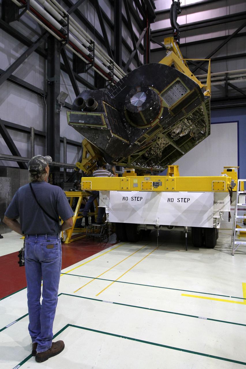 CAPE CANAVERAL, Fla. – In Orbiter Processing Facility-1 at NASA’s Kennedy Space Center in Florida, a handling fixture lifts an orbital maneuvering system, or OMS, pod from its transporter. The pod will be reinstalled on space shuttle Atlantis. The orbital maneuvering system provided the shuttle with thrust for orbit insertion, rendezvous and deorbit, and could provide up to 1,000 pounds of propellant to the aft reaction control system. The OMS is housed in two independent pods located on each side of the shuttle's aft fuselage. Each pod contains one OMS engine and the hardware needed to pressurize, store and distribute the propellants to perform the velocity maneuvers. Atlantis’ OMS pods were removed and sent to White Sands Test Facility in New Mexico to be cleaned of residual toxic propellant. The work is part of the Space Shuttle Program’s transition and retirement processing of the shuttle fleet. A groundbreaking was held Jan. 18 for Atlantis' future home, a 65,000-square-foot exhibit hall in Shuttle Plaza at the Kennedy Space Center Visitor Complex. Atlantis is scheduled to roll over to the visitor complex in November in preparation for the exhibit’s grand opening in July 2013. For more information, visit http://www.nasa.gov/transition. Photo credit: NASA/Kim Shiflett