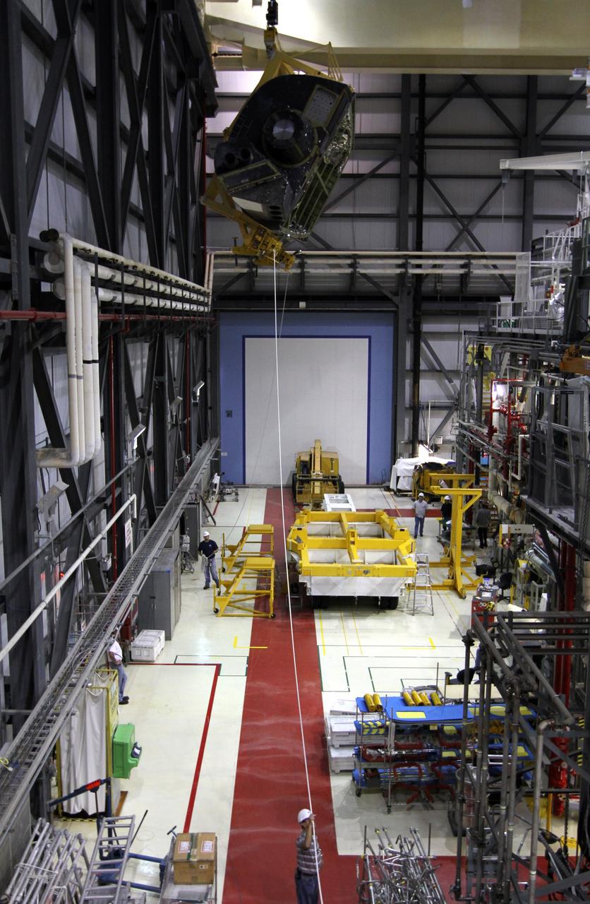 CAPE CANAVERAL, Fla. – An orbital maneuvering system, or OMS, pod glides across the ceiling away from its transporter in Orbiter Processing Facility-1 at NASA’s Kennedy Space Center in Florida. The pod will be reinstalled on space shuttle Atlantis. The orbital maneuvering system provided the shuttle with thrust for orbit insertion, rendezvous and deorbit, and could provide up to 1,000 pounds of propellant to the aft reaction control system. The OMS is housed in two independent pods located on each side of the shuttle's aft fuselage. Each pod contains one OMS engine and the hardware needed to pressurize, store and distribute the propellants to perform the velocity maneuvers. Atlantis’ OMS pods were removed and sent to White Sands Test Facility in New Mexico to be cleaned of residual toxic propellant. The work is part of the Space Shuttle Program’s transition and retirement processing of the shuttle fleet. A groundbreaking was held Jan. 18 for Atlantis' future home, a 65,000-square-foot exhibit hall in Shuttle Plaza at the Kennedy Space Center Visitor Complex. Atlantis is scheduled to roll over to the visitor complex in November in preparation for the exhibit’s grand opening in July 2013. For more information, visit http://www.nasa.gov/transition. Photo credit: NASA/Kim Shiflett