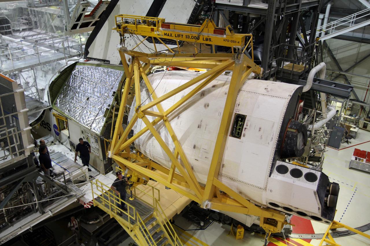 CAPE CANAVERAL, Fla. – In Orbiter Processing Facility-1 at NASA’s Kennedy Space Center in Florida, United Space Alliance technicians prepare to reinstall on space shuttle Atlantis the orbital maneuvering system, or OMS, pod heading their way. The orbital maneuvering system provided the shuttle with thrust for orbit insertion, rendezvous and deorbit, and could provide up to 1,000 pounds of propellant to the aft reaction control system. The OMS is housed in two independent pods located on each side of the shuttle's aft fuselage. Each pod contains one OMS engine and the hardware needed to pressurize, store and distribute the propellants to perform the velocity maneuvers. Atlantis’ OMS pods were removed and sent to White Sands Test Facility in New Mexico to be cleaned of residual toxic propellant. The work is part of the Space Shuttle Program’s transition and retirement processing of the shuttle fleet. A groundbreaking was held Jan. 18 for Atlantis' future home, a 65,000-square-foot exhibit hall in Shuttle Plaza at the Kennedy Space Center Visitor Complex. Atlantis is scheduled to roll over to the visitor complex in November in preparation for the exhibit’s grand opening in July 2013. For more information, visit http://www.nasa.gov/transition. Photo credit: NASA/Kim Shiflett