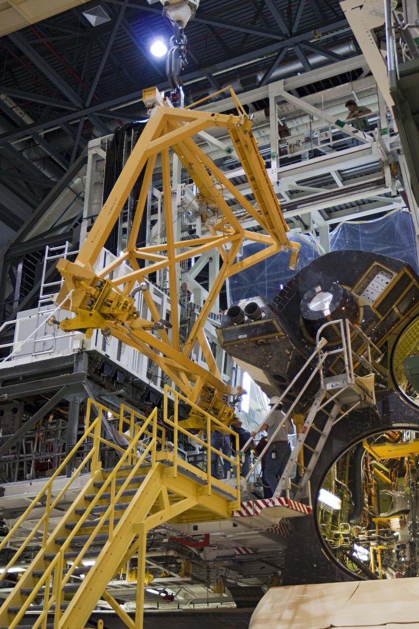 CAPE CANAVERAL, Fla. – Inside Orbiter Processing Facility-1 at NASA’s Kennedy Space Center in Florida, a large crane was used to lower the left orbital maneuvering system, or OMS, pod onto space shuttle Atlantis. The OMS provided the shuttle with thrust for orbit insertion, rendezvous and deorbit, and could provide up to 1,000 pounds of propellant to the aft reaction control system.    The OMS is housed in two independent pods located on each side of the shuttle’s aft fuselage. Each pod contains one OMS engine and the hardware needed to pressurize, store and distribute the propellants to perform the velocity maneuvers. Atlantis’ OMS pods were removed and sent to White Sands Test Facility in New Mexico to be cleaned of residual toxic propellant. The work is part of the Space Shuttle Program’s transition and retirement processing of the space shuttle fleet. A groundbreaking was held Jan. 18 for Atlantis’ future home, a 65,000-square-foot exhibit hall in Shuttle Plaza at the Kennedy Space Center Visitor Complex. Atlantis is scheduled to roll over to the visitor complex in November in preparation for the exhibit’s grand opening in July 2013. For more information, visit http://www.nasa.gov/transition. Photo credit: NASA/Ben Smegelsky