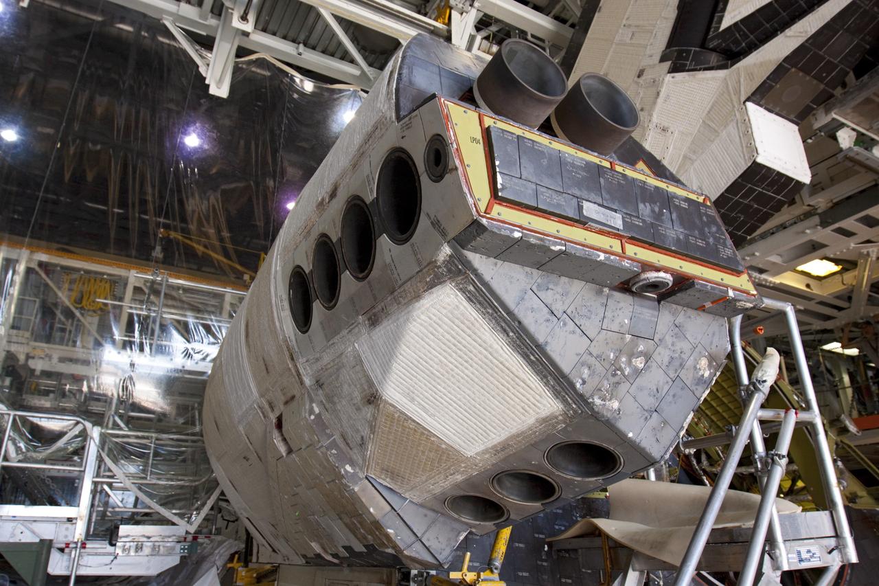 CAPE CANAVERAL, Fla. – Inside Orbiter Processing Facility-1 at NASA’s Kennedy Space Center in Florida, the left orbital maneuvering system, or OMS, pod has been installed onto space shuttle Atlantis. The OMS provided the shuttle with thrust for orbit insertion, rendezvous and deorbit, and could provide up to 1,000 pounds of propellant to the aft reaction control system.    The OMS is housed in two independent pods located on each side of the shuttle’s aft fuselage. Each pod contains one OMS engine and the hardware needed to pressurize, store and distribute the propellants to perform the velocity maneuvers. Atlantis’ OMS pods were removed and sent to White Sands Test Facility in New Mexico to be cleaned of residual toxic propellant. The work is part of the Space Shuttle Program’s transition and retirement processing of the space shuttle fleet. A groundbreaking was held Jan. 18 for Atlantis’ future home, a 65,000-square-foot exhibit hall in Shuttle Plaza at the Kennedy Space Center Visitor Complex. Atlantis is scheduled to roll over to the visitor complex in November in preparation for the exhibit’s grand opening in July 2013. For more information, visit http://www.nasa.gov/transition. Photo credit: NASA/Ben Smegelsky