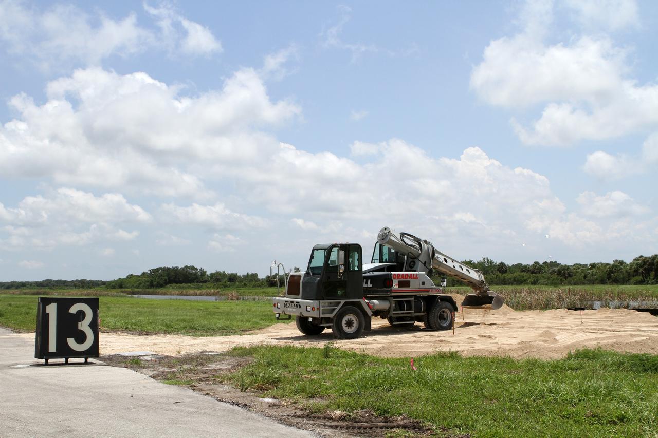 CAPE CANAVERAL, Fla. – Steady progress is made on the construction of the hazard field for the Project Morpheus lander near the Shuttle Landing Facility at NASA’s Kennedy Space Center in Florida. Testing of the prototype lander has been ongoing at NASA's Johnson Space Center in Houston in preparation for its first free flight. The SLF will provide the lander with the kind of field necessary for realistic testing, complete with rocks, craters and hazards to avoid. Morpheus utilizes an autonomous landing and hazard avoidance technology, or ALHAT, payload that will allow it to navigate to clear landing sites amidst rocks, craters and other hazards during its descent. Project Morpheus is one of 20 small projects comprising the Advanced Exploration Systems, or AES, program in NASA's Human Exploration and Operations Mission Directorate. AES projects pioneer new approaches for rapidly developing prototype systems, demonstrating key capabilities and validating operational concepts for future human missions beyond Earth orbit. For more information on Project Morpheus, visit http://www.nasa.gov/centers/johnson/exploration/morpheus/index.html. Photo credit: NASA/Kim Shiflett