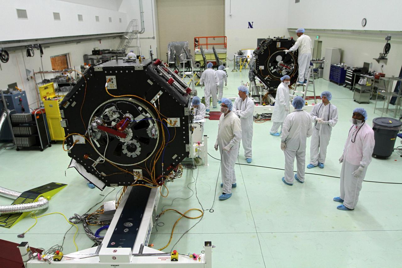 CAPE CANAVERAL, Fla. – Inside the Astrotech payload processing facility near NASA’s Kennedy Space Center in Florida, technicians monitor the progress as the Radiation Belt Storm Probes, or RBSP, spacecraft B is lowered to a horizontal position. The RBSP had been in a vertical position for testing. NASA’s RBSP mission will help us understand the sun’s influence on Earth and near-Earth space by studying the Earth’s radiation belts on various scales of space and time. RBSP will begin its mission of exploration of Earth’s Van Allen radiation belts and the extremes of space weather after its launch aboard a United Launch Alliance Atlas V rocket. Launch is targeted for Aug. 23. For more information, visit http://www.nasa.gov/rbsp. Photo credit: NASA/Kim Shiflett