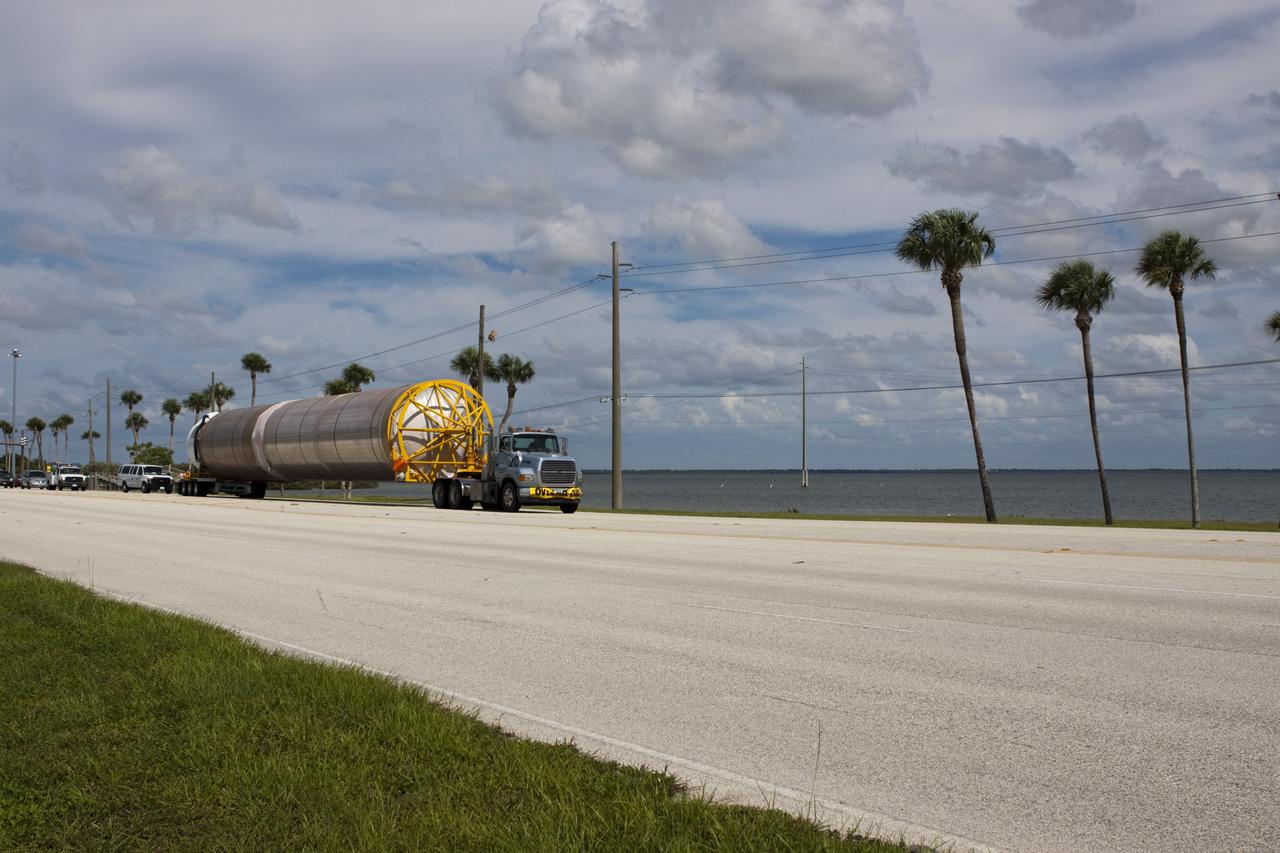 CAPE CANAVERAL, Fla. – Framed by palm trees and backdropped by the Banana River, the United Launch Alliance Atlas V first stage booster for NASA's Radiation Belt Storm Probes mission arrives at Cape Canaveral Air Force Station in Florida. The booster was delivered by barge to nearby Port Canaveral.    The Radiation Belt Storm Probes, or RBSP, mission will help us understand the sun’s influence on Earth and near-Earth space by studying the Earth’s radiation belts on various scales of space and time. For more information, visit http://www.nasa.gov/rbsp. Photo credit: NASA/Jim Grossmann