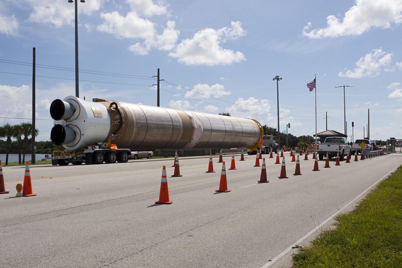 CAPE CANAVERAL, Fla. – The United Launch Alliance Atlas V first stage booster for NASA's Radiation Belt Storm Probes mission passes the secure gate at Cape Canaveral Air Force Station in Florida en route to the Atlas Spaceflight Operations Center, or ASOC.    The Radiation Belt Storm Probes, or RBSP, mission will help us understand the sun’s influence on Earth and near-Earth space by studying the Earth’s radiation belts on various scales of space and time. For more information, visit http://www.nasa.gov/rbsp. Photo credit: NASA/Jim Grossmann