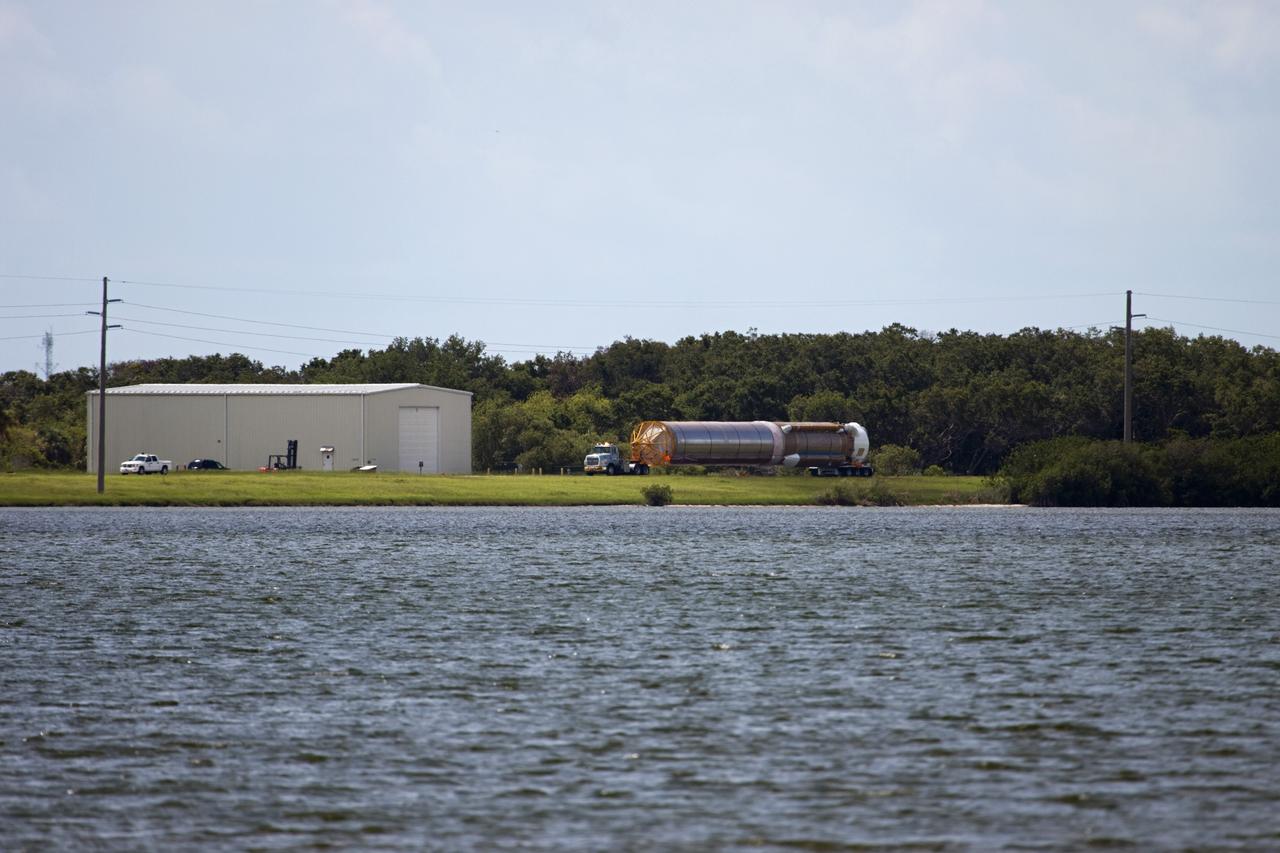 CAPE CANAVERAL, Fla. – The United Launch Alliance Atlas V first stage booster for NASA's Radiation Belt Storm Probes mission travels through Cape Canaveral Air Force Station in Florida en route to the Atlas Spaceflight Operations Center, or ASOC.    The Radiation Belt Storm Probes, or RBSP, mission will help us understand the sun’s influence on Earth and near-Earth space by studying the Earth’s radiation belts on various scales of space and time. For more information, visit http://www.nasa.gov/rbsp. Photo credit: NASA/Jim Grossmann