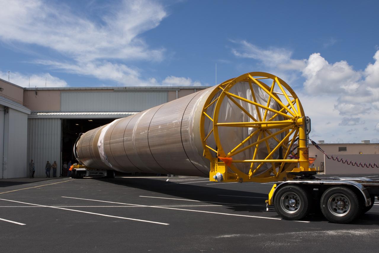 CAPE CANAVERAL, Fla. – The United Launch Alliance Atlas V first stage booster for NASA's Radiation Belt Storm Probes mission begins moving into the Atlas Spaceflight Operations Center, or ASOC, at Cape Canaveral Air Force Station in Florida.    The Radiation Belt Storm Probes, or RBSP, mission will help us understand the sun’s influence on Earth and near-Earth space by studying the Earth’s radiation belts on various scales of space and time. For more information, visit http://www.nasa.gov/rbsp. Photo credit: NASA/Jim Grossmann