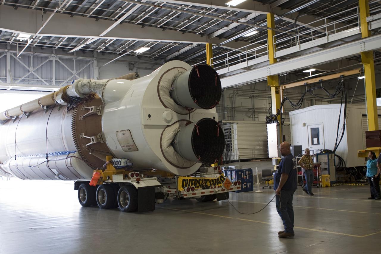 CAPE CANAVERAL, Fla. – The United Launch Alliance Atlas V first stage booster for NASA's Radiation Belt Storm Probes mission backs into the Atlas Spaceflight Operations Center, or ASOC, at Cape Canaveral Air Force Station in Florida.    The Radiation Belt Storm Probes, or RBSP, mission will help us understand the sun’s influence on Earth and near-Earth space by studying the Earth’s radiation belts on various scales of space and time. For more information, visit http://www.nasa.gov/rbsp. Photo credit: NASA/Jim Grossmann
