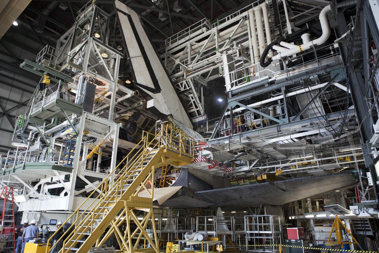 CAPE CANAVERAL, Fla. – Inside Orbiter Processing Facility-1 at NASA’s Kennedy Space Center in Florida,  preparations are underway to install the right orbital maneuvering system, or OMS, pod on space shuttle Atlantis. It will be the last time an OMS pod is installed on Atlantis. The OMS provided the shuttle with thrust for orbit insertion, rendezvous and deorbit, and could provide up to 1,000 pounds of propellant to the aft reaction control system.    The OMS is housed in two independent pods located on each side of the shuttle’s aft fuselage. Each pod contains one OMS engine and the hardware needed to pressurize, store and distribute the propellants to perform the velocity maneuvers. Atlantis’ OMS pods were removed and sent to the test facility at White Sands Space Harbor in New Mexico to be cleaned of residual toxic propellant. The work is part of the Space Shuttle Program’s transition and retirement processing of the space shuttle fleet. A groundbreaking was held Jan. 18 for Atlantis’ future home, a 65,000-square-foot exhibit hall in Shuttle Plaza at the Kennedy Space Center Visitor Complex. Atlantis is scheduled to roll over to the visitor complex in November in preparation for the exhibit’s grand opening in July 2013. For more information, visit http://www.nasa.gov/transition. Photo credit: NASA/Dimitri Gerondidakis