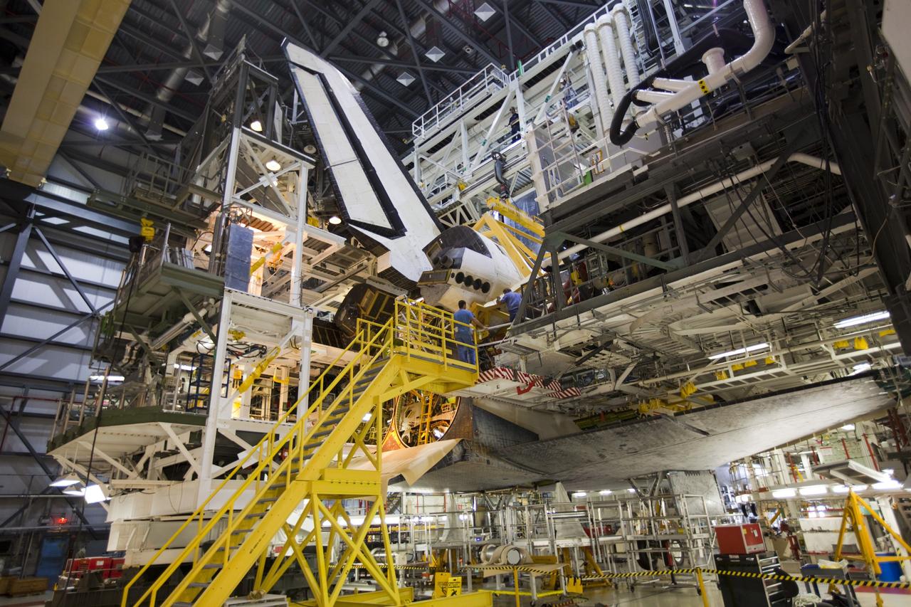 CAPE CANAVERAL, Fla. – Inside Orbiter Processing Facility-1 at NASA’s Kennedy Space Center in Florida, a large crane lowers the right orbital maneuvering system, or OMS, pod onto space shuttle Atlantis. It is the last time an OMS pod will be installed on Atlantis. The OMS provided the shuttle with thrust for orbit insertion, rendezvous and deorbit, and could provide up to 1,000 pounds of propellant to the aft reaction control system.    The OMS is housed in two independent pods located on each side of the shuttle’s aft fuselage. Each pod contains one OMS engine and the hardware needed to pressurize, store and distribute the propellants to perform the velocity maneuvers. Atlantis’ OMS pods were removed and sent to the test facility at White Sands Space Harbor in New Mexico to be cleaned of residual toxic propellant. The work is part of the Space Shuttle Program’s transition and retirement processing of the space shuttle fleet. A groundbreaking was held Jan. 18 for Atlantis’ future home, a 65,000-square-foot exhibit hall in Shuttle Plaza at the Kennedy Space Center Visitor Complex. Atlantis is scheduled to roll over to the visitor complex in November in preparation for the exhibit’s grand opening in July 2013. For more information, visit http://www.nasa.gov/transition. Photo credit: NASA/Dimitri Gerondidakis