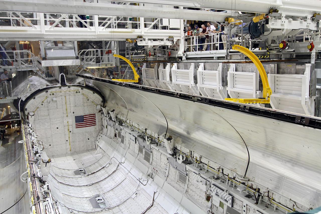 CAPE CANAVERAL, Fla. – Inside Orbiter Processing Facility-2 at NASA’s Kennedy Space Center in Florida, United Space Alliance technicians monitor the progress as space shuttle Endeavour’s payload bay doors begin to close for the final time. The work is part of Transition and Retirement of the remaining space shuttles, Endeavour and Atlantis. Endeavour is being prepared for public display at the California Science Center in Los Angeles. Its ferry flight to California is targeted for mid-September. Endeavour was the last space shuttle added to NASA’s orbiter fleet. Over the course of its 19-year career, Endeavour spent 299 days in space during 25 missions. For more information, visit http://www.nasa.gov/shuttle. Photo credit: NASA/Kim Shiflett