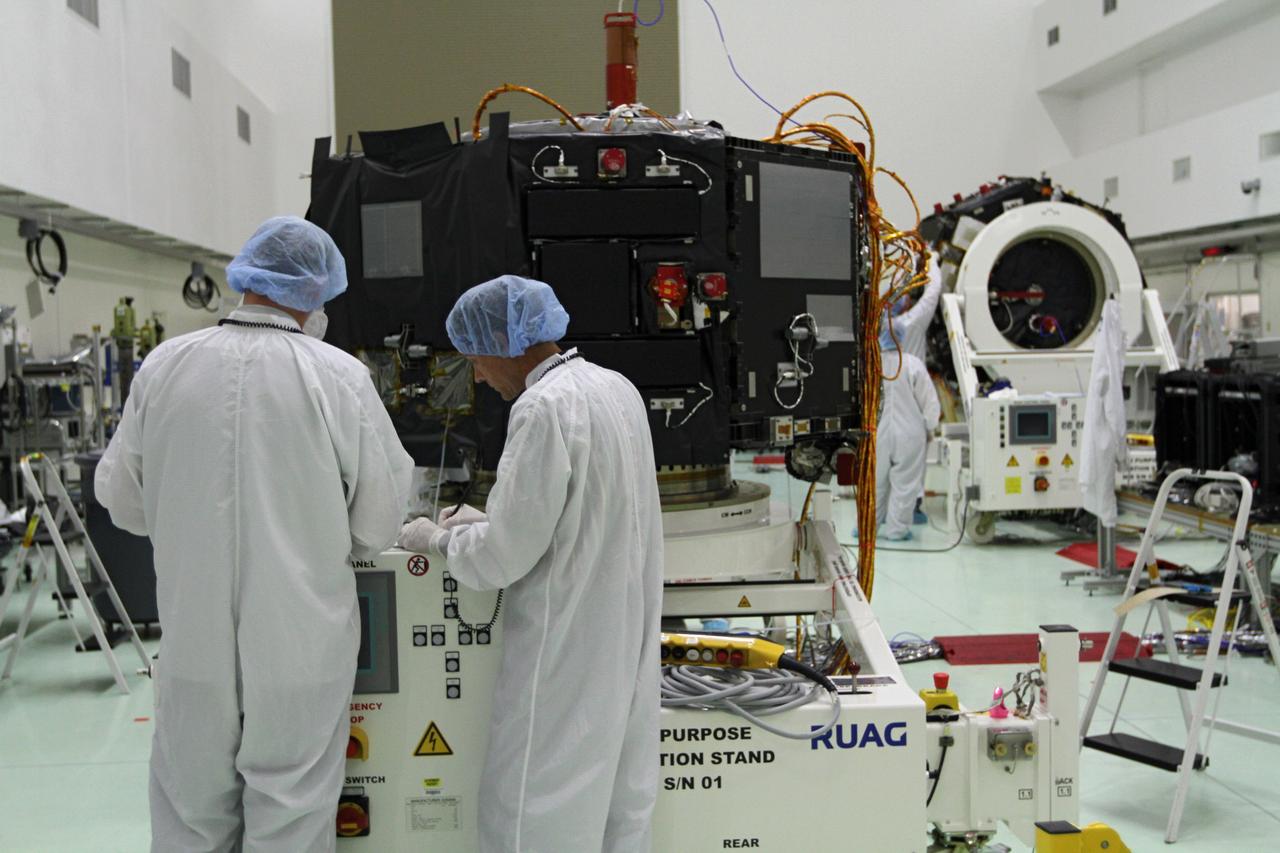 CAPE CANAVERAL, Fla. – Inside the Astrotech payload processing facility near NASA’s Kennedy Space Center in Florida, technicians prepare to install protective thermal blankets around the Radiation Belt Storm Probes, or RBSP, spacecraft A. NASA’s RBSP mission will help us understand the sun’s influence on Earth and near-Earth space by studying the Earth’s radiation belts on various scales of space and time. RBSP will begin its mission of exploration of Earth’s Van Allen radiation belts and the extremes of space weather after its launch aboard a United Launch Alliance Atlas V rocket. Launch is targeted for Aug. 23. For more information, visit http://www.nasa.gov/rbsp. Photo credit: NASA/Kim Shiflett