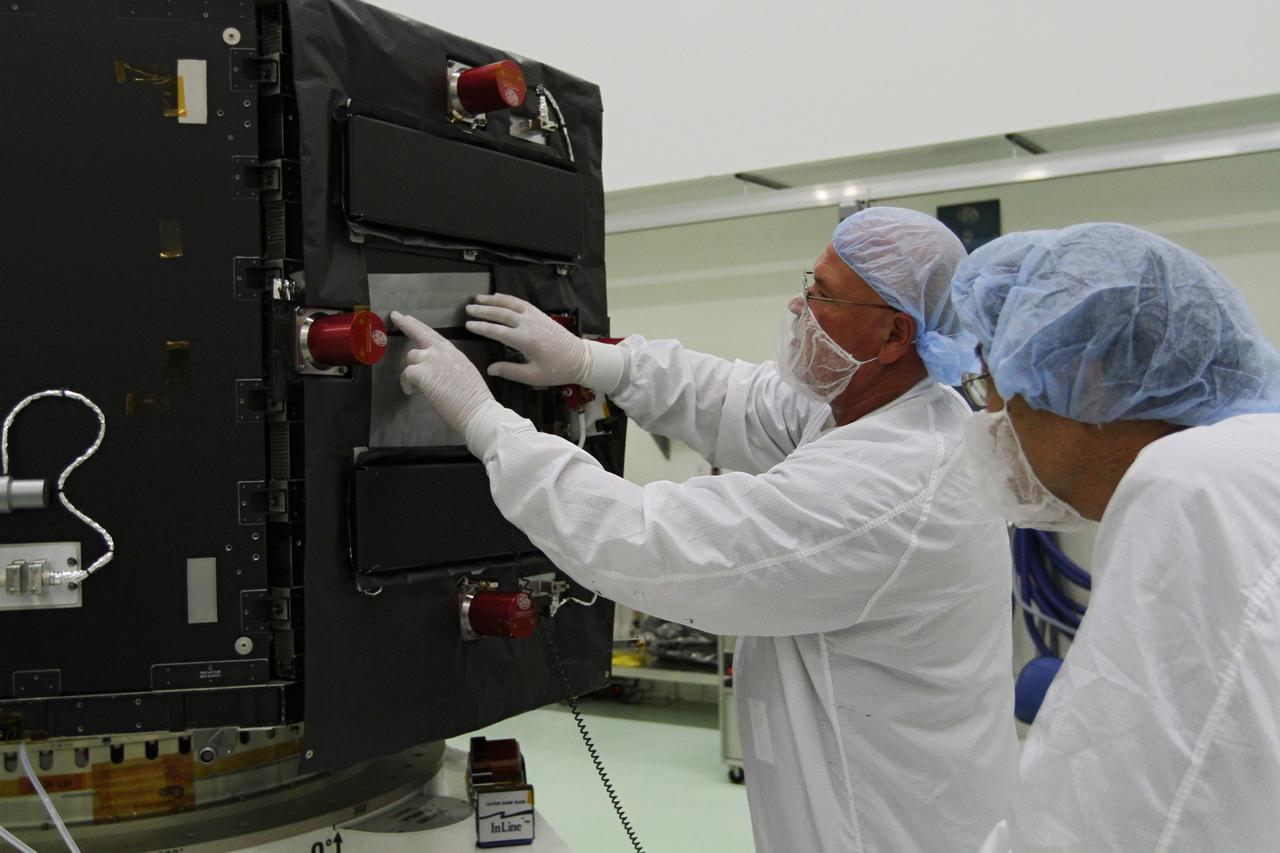 CAPE CANAVERAL, Fla. – Inside the Astrotech payload processing facility near NASA’s Kennedy Space Center in Florida, technicians install protective thermal blankets around the Radiation Belt Storm Probes, or RBSP, spacecraft A. NASA’s RBSP mission will help us understand the sun’s influence on Earth and near-Earth space by studying the Earth’s radiation belts on various scales of space and time. RBSP will begin its mission of exploration of Earth’s Van Allen radiation belts and the extremes of space weather after its launch aboard a United Launch Alliance Atlas V rocket. Launch is targeted for Aug. 23. For more information, visit http://www.nasa.gov/rbsp. Photo credit: NASA/Kim Shiflett